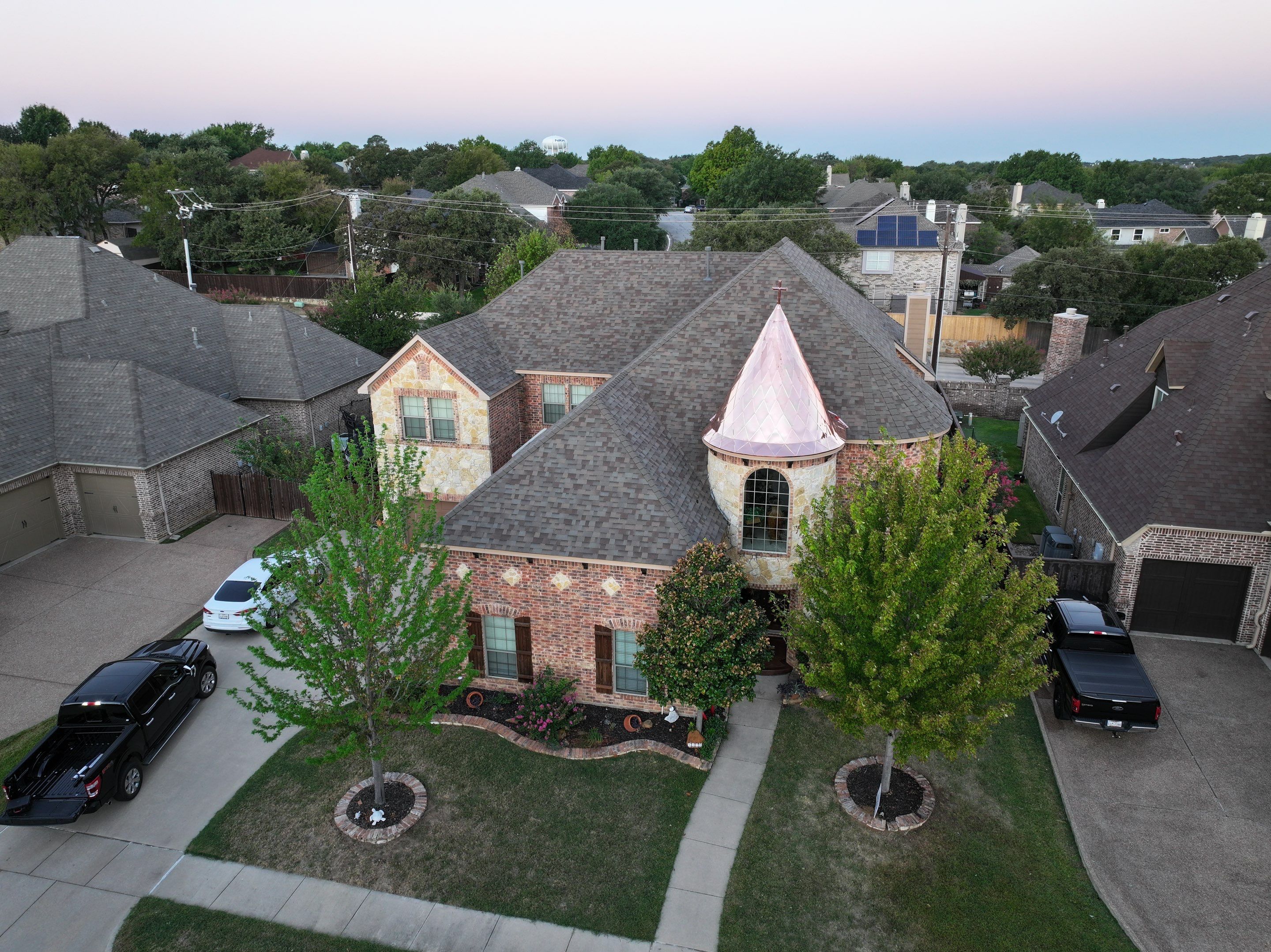 Installing Custom copper turret and Malarkey Vista Class 4 shingles Hail Damage Upgrade by Becker Roofing and Exteriors
