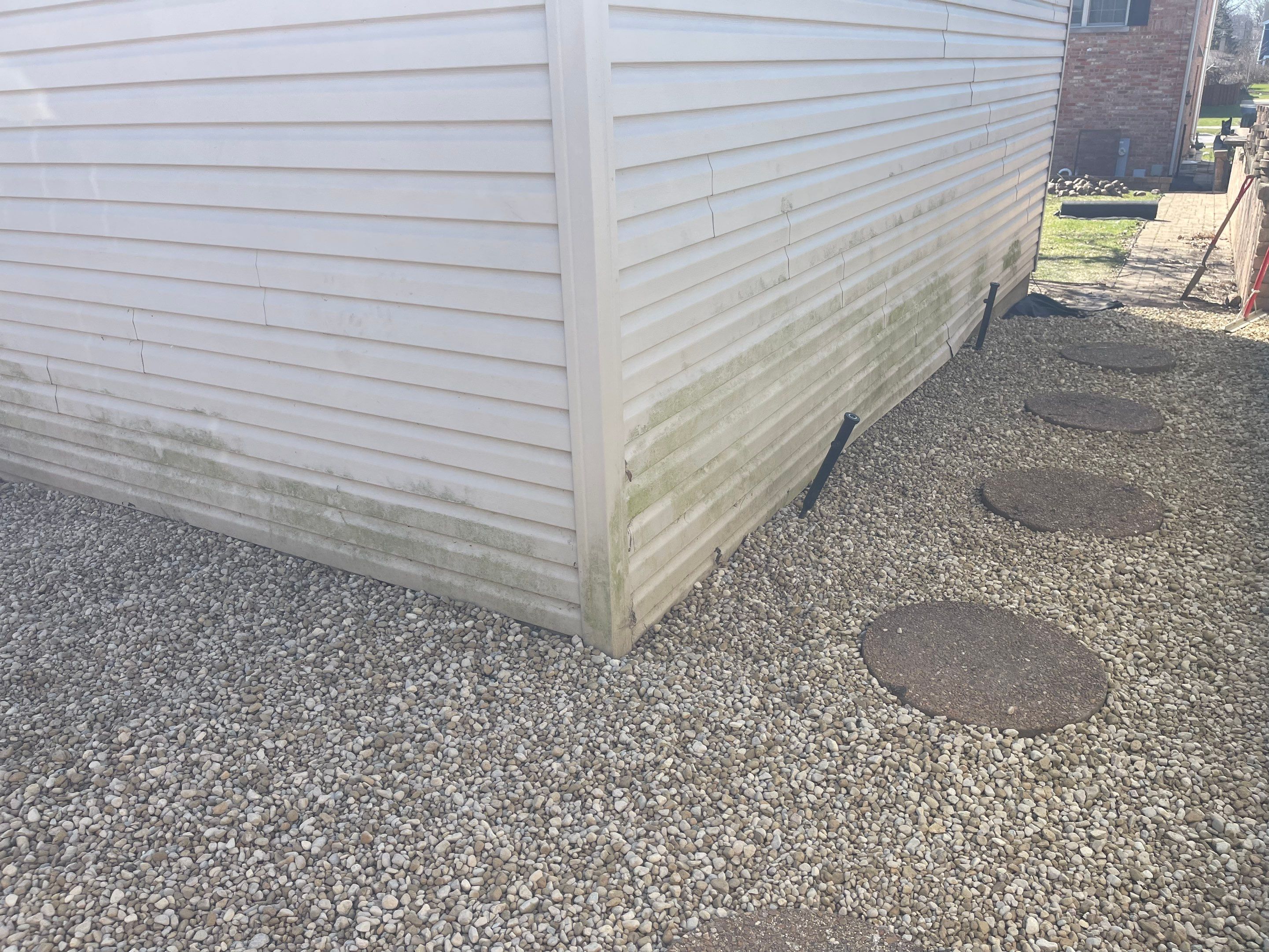 Rock Installation behind garage  by A&N 