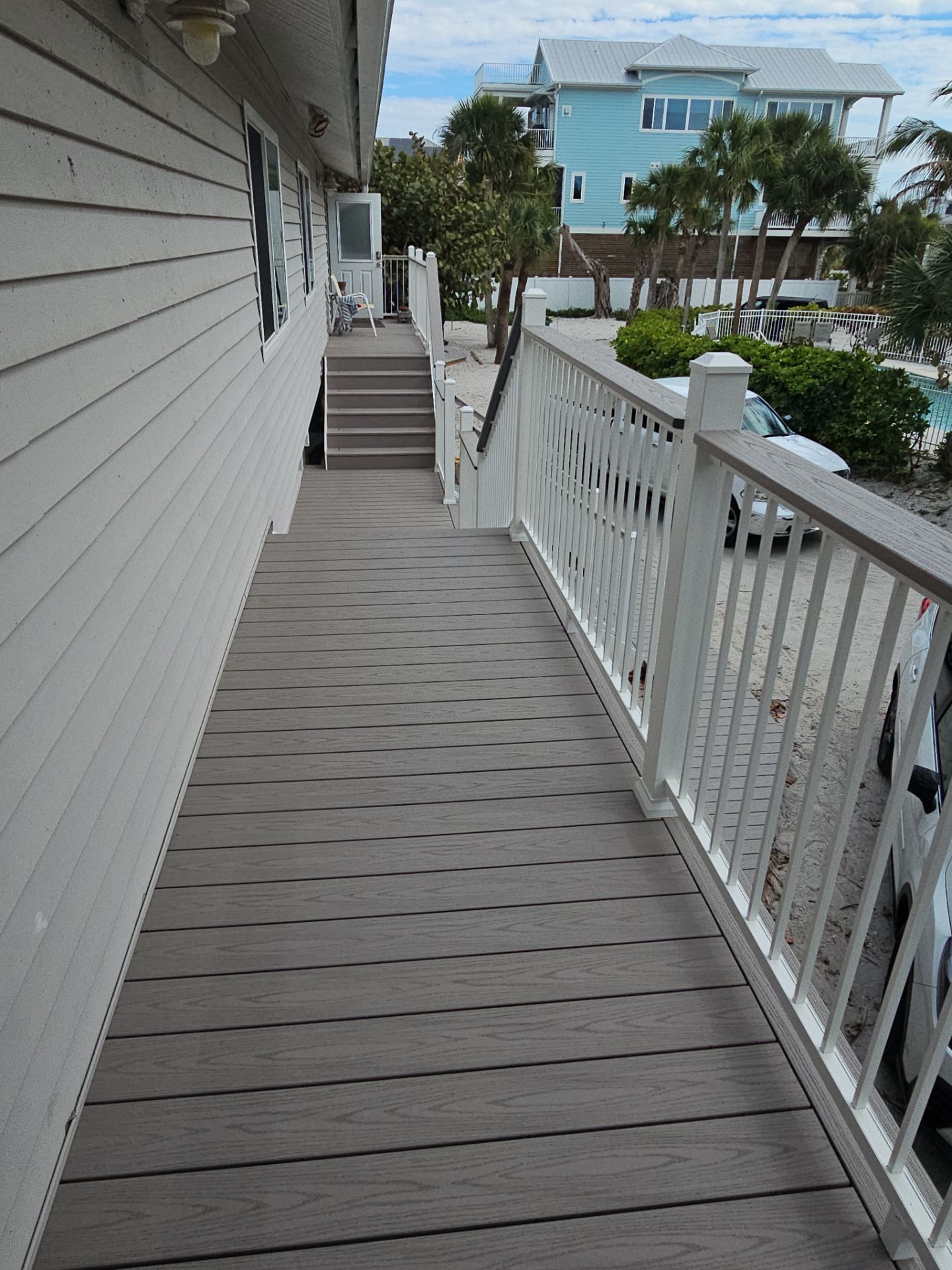 Elevated Composite Deck and Symmetrical Staircase Replacement in Englewood by Smirnov Construction Inc