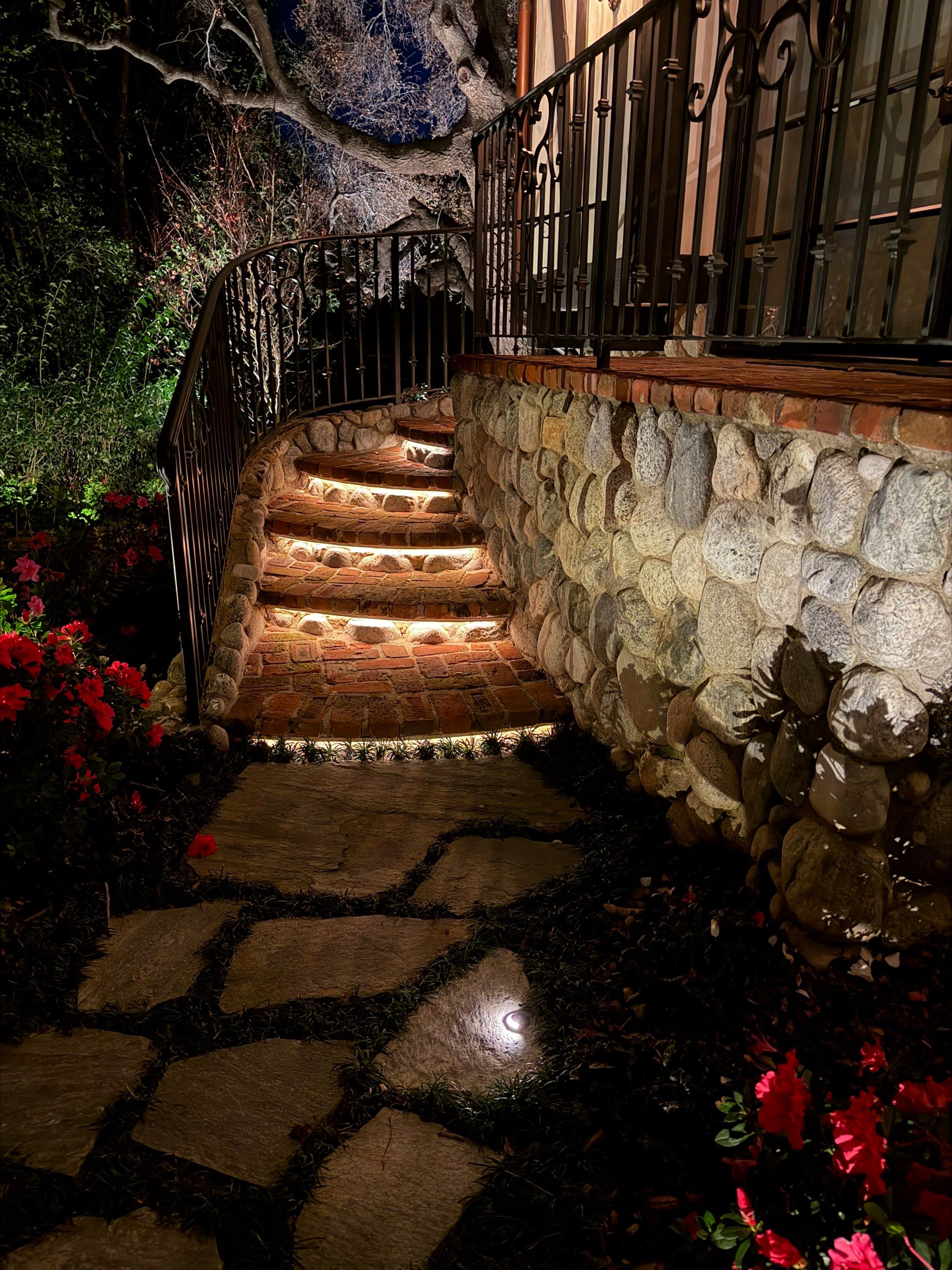 Tudor Estate Landscape Lighting with Integrated Stone Step Illumination by Outdoor Lights + Shades