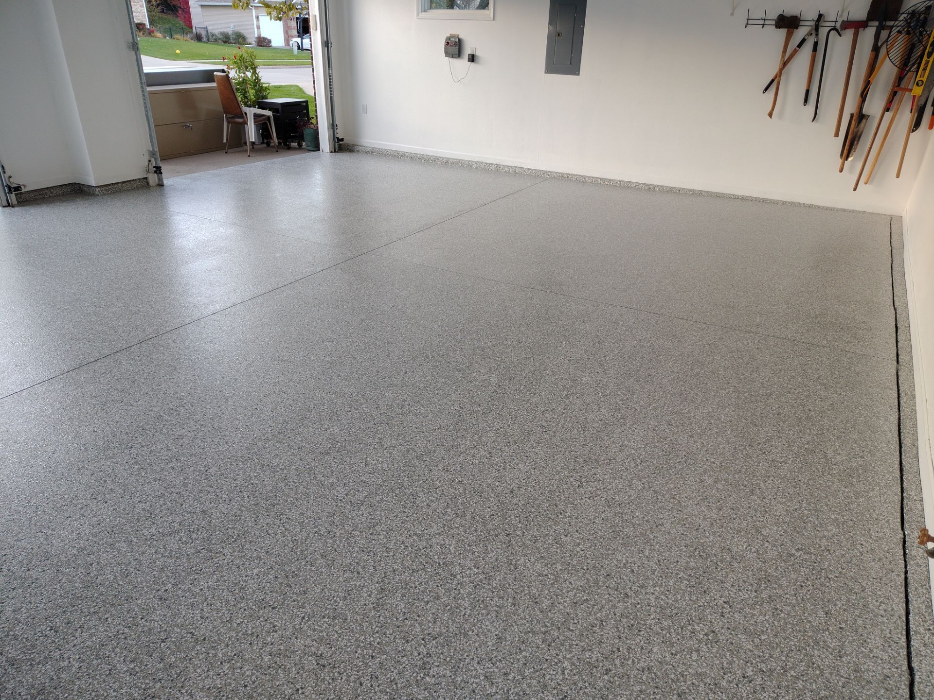 New Johnston Garage Resurfacing by Revival Concrete Coatings, LLC