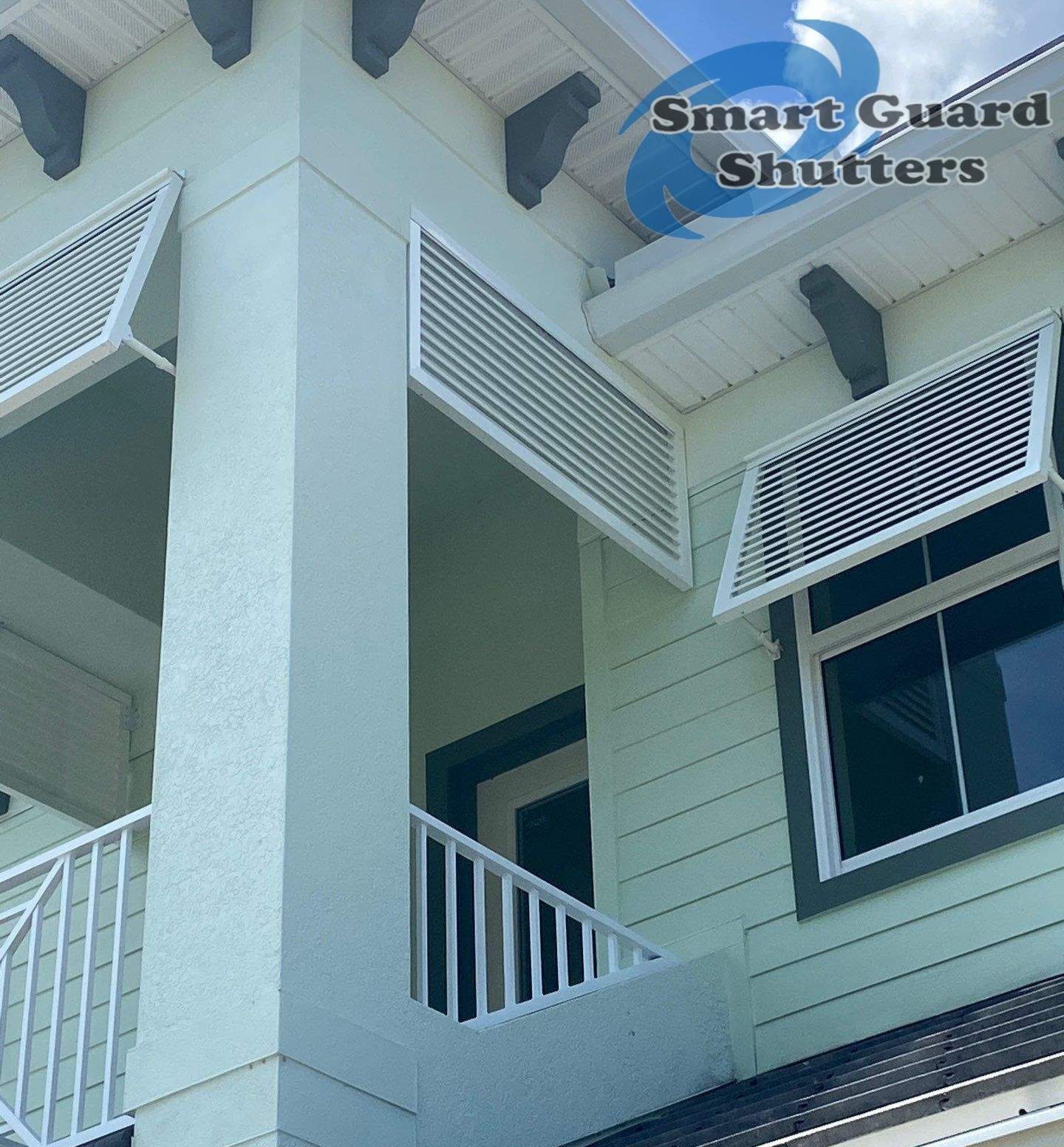 Decorative Bahama Shutters in Traffic White by Smart Guard Shutters