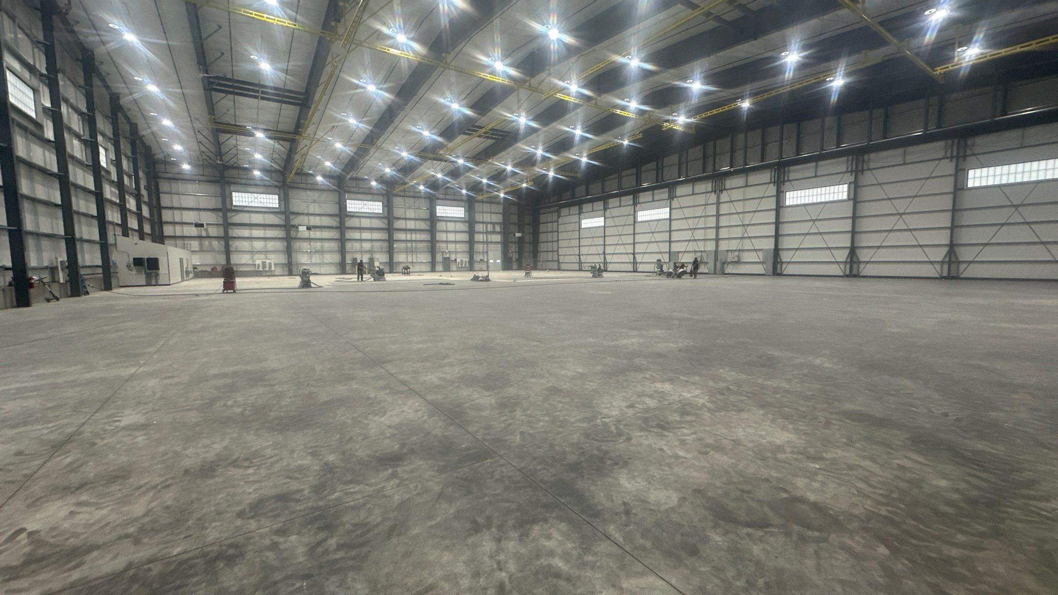 Airplane Hanger using Light Grey Commercial Penntek Epoxy by Croc Coatings, LLC
