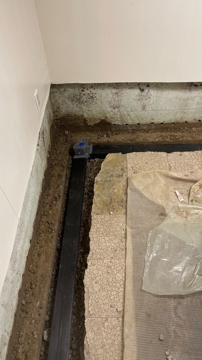 Interior Waterproofing Using GrateDrain™ Products by Toledo Basement Repair 