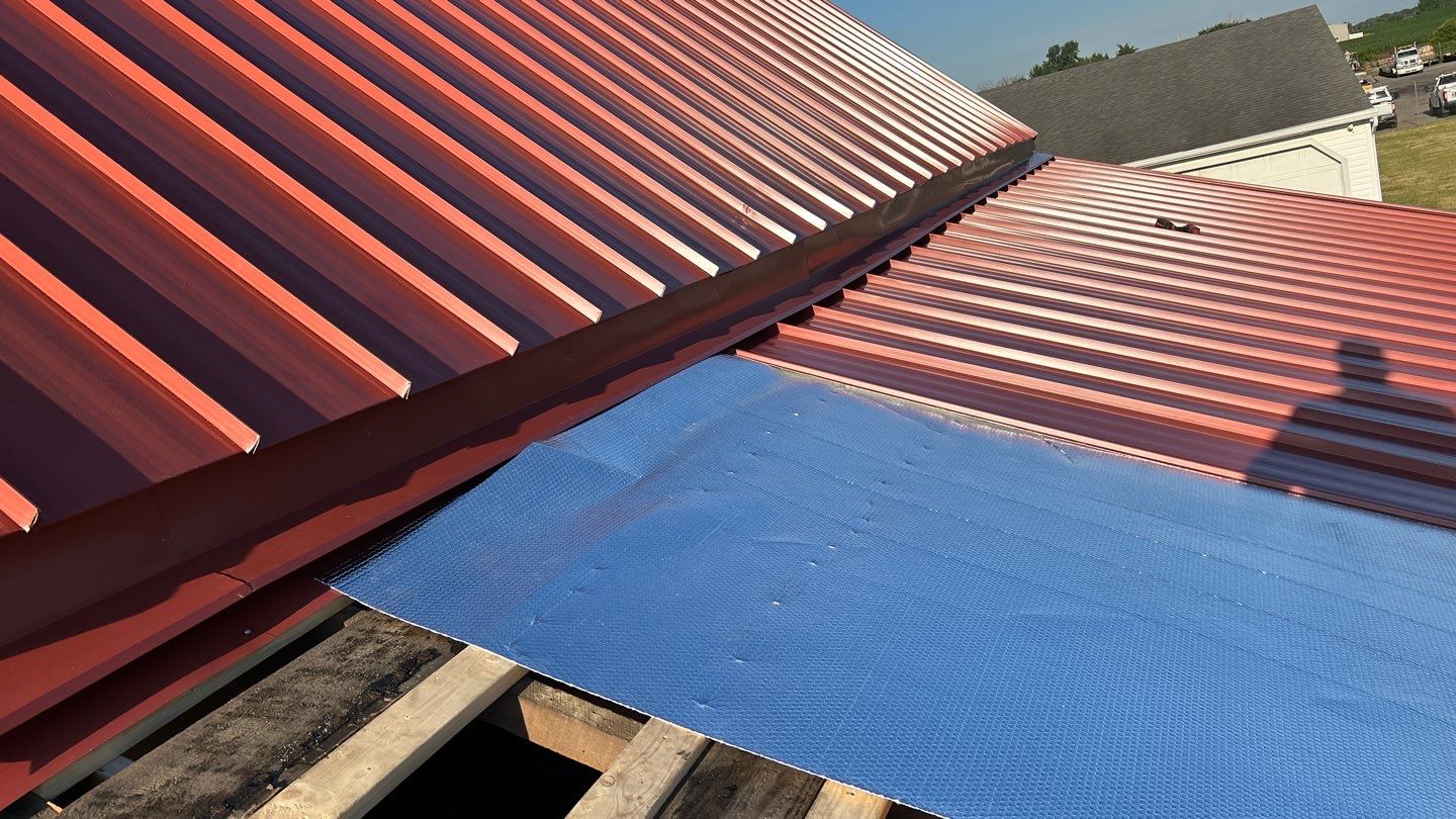 Residential Roofing Installation using Standing Seam Metal - Barn Red by RoofX 