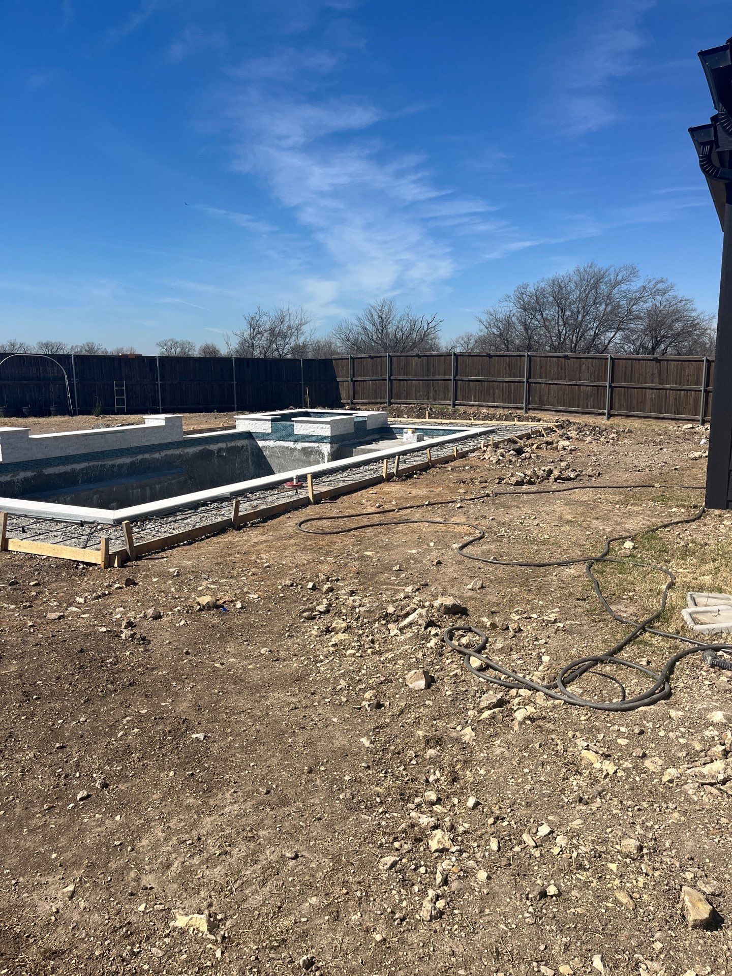 Geometric Pool with Elevated Spa and Night Lighting by Pinnacle Pools and Spas - DFW