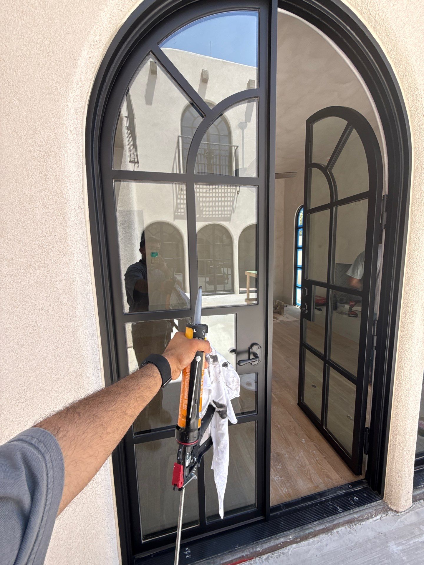 Arched Black Metal French Door Installation and Finishing in Fort Worth by Solara Custom Living