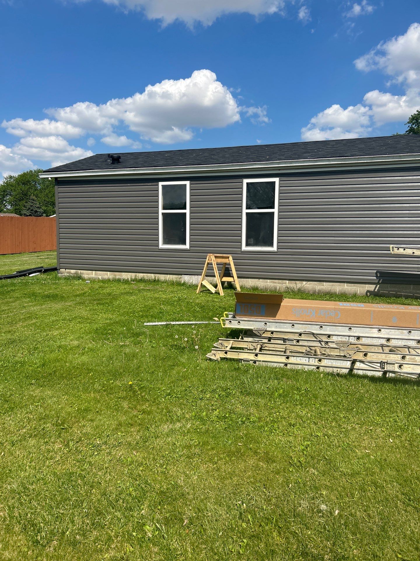 Roof and Siding Replacement using Norandex Cedar Knoll Graphite Siding and Owens Corning Durations in Onyx Black by WIW Enterprises Inc