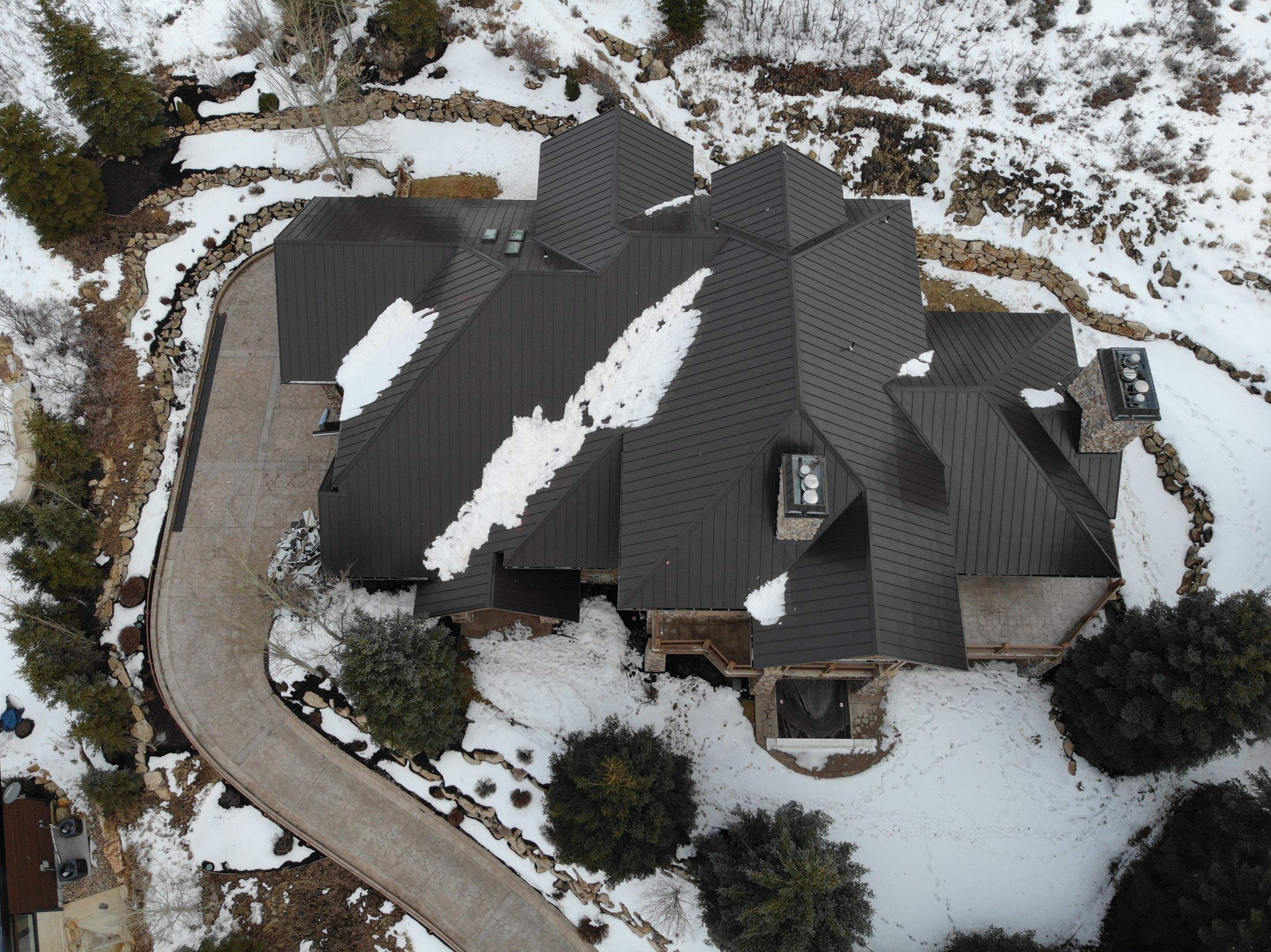 Standing Seam Metal Roof Replacement After Snow Damage by ASAP Roofing & Restoration