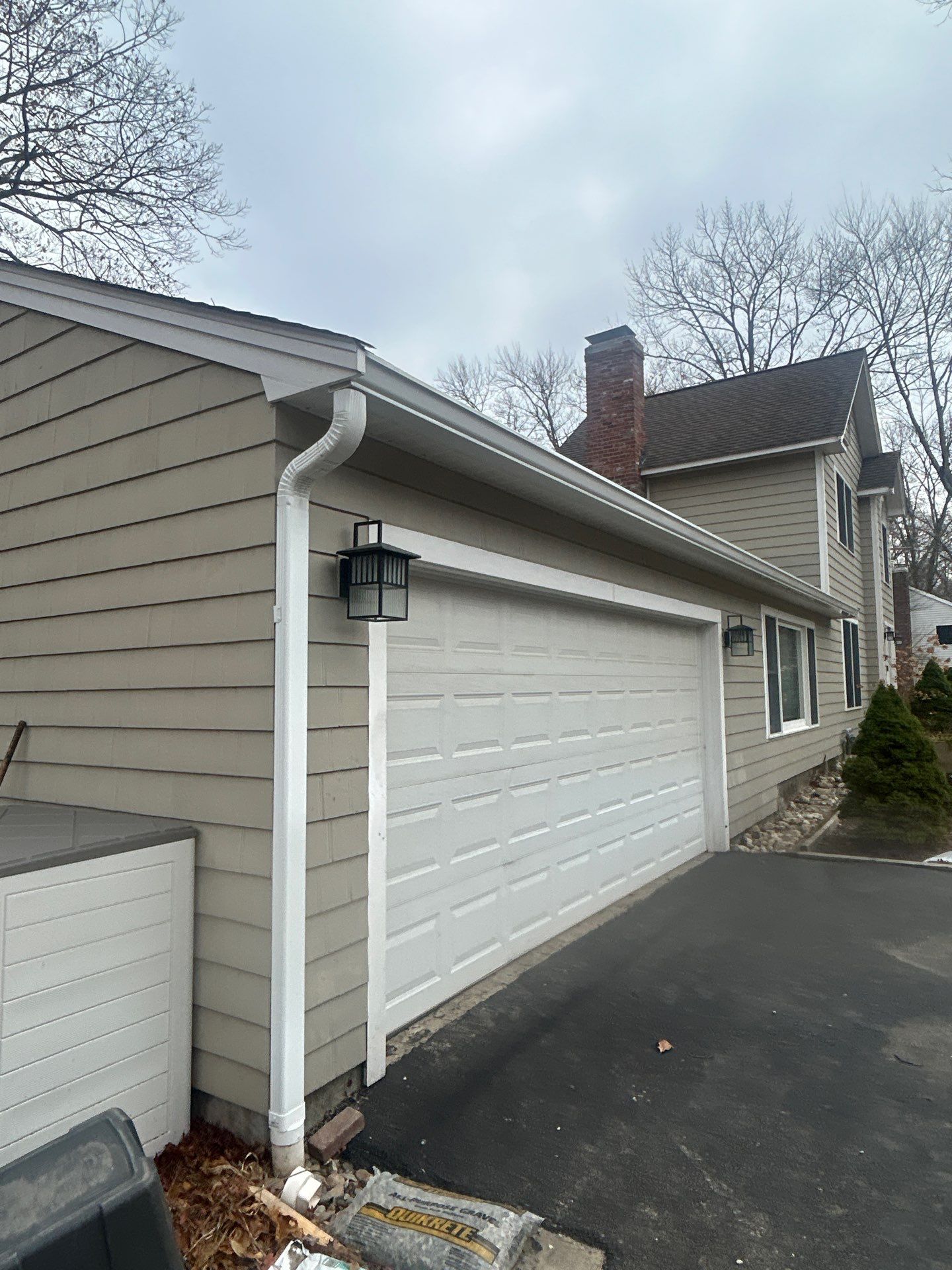 Chelmsford Garage Gutter System with French Drain Integration by Mighty Dog Roofing of Greater Middlesex County