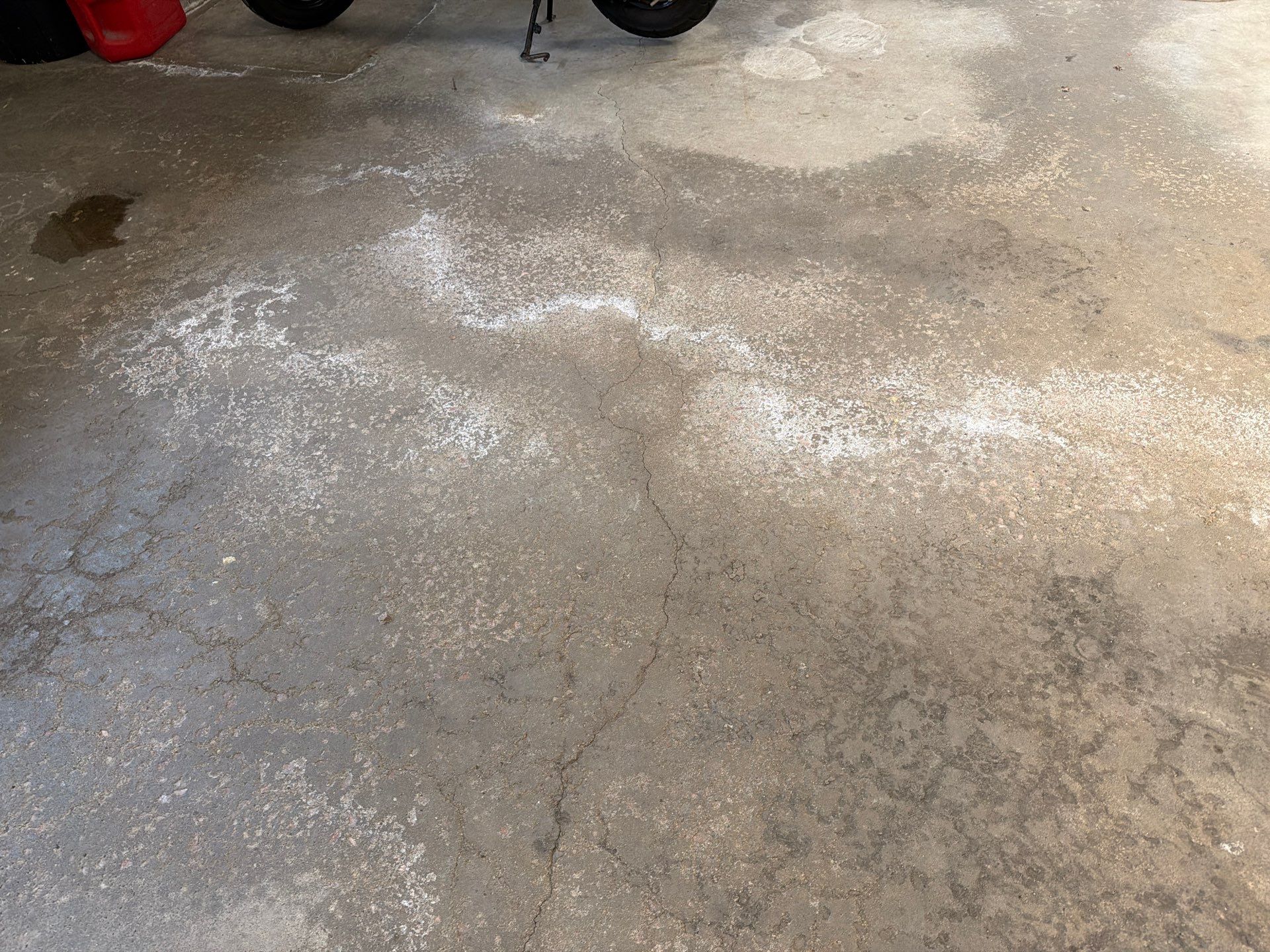 Feather Grey Garage Floor Coating Installation in Sioux Falls by Select Painting, Coatings & Garage Cabinets