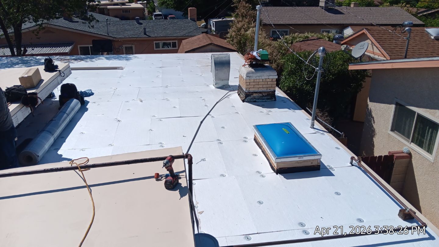 Residential TPO Roof Replacement and skylight replacement in Albuquerque by Doyle Roof Masters Inc