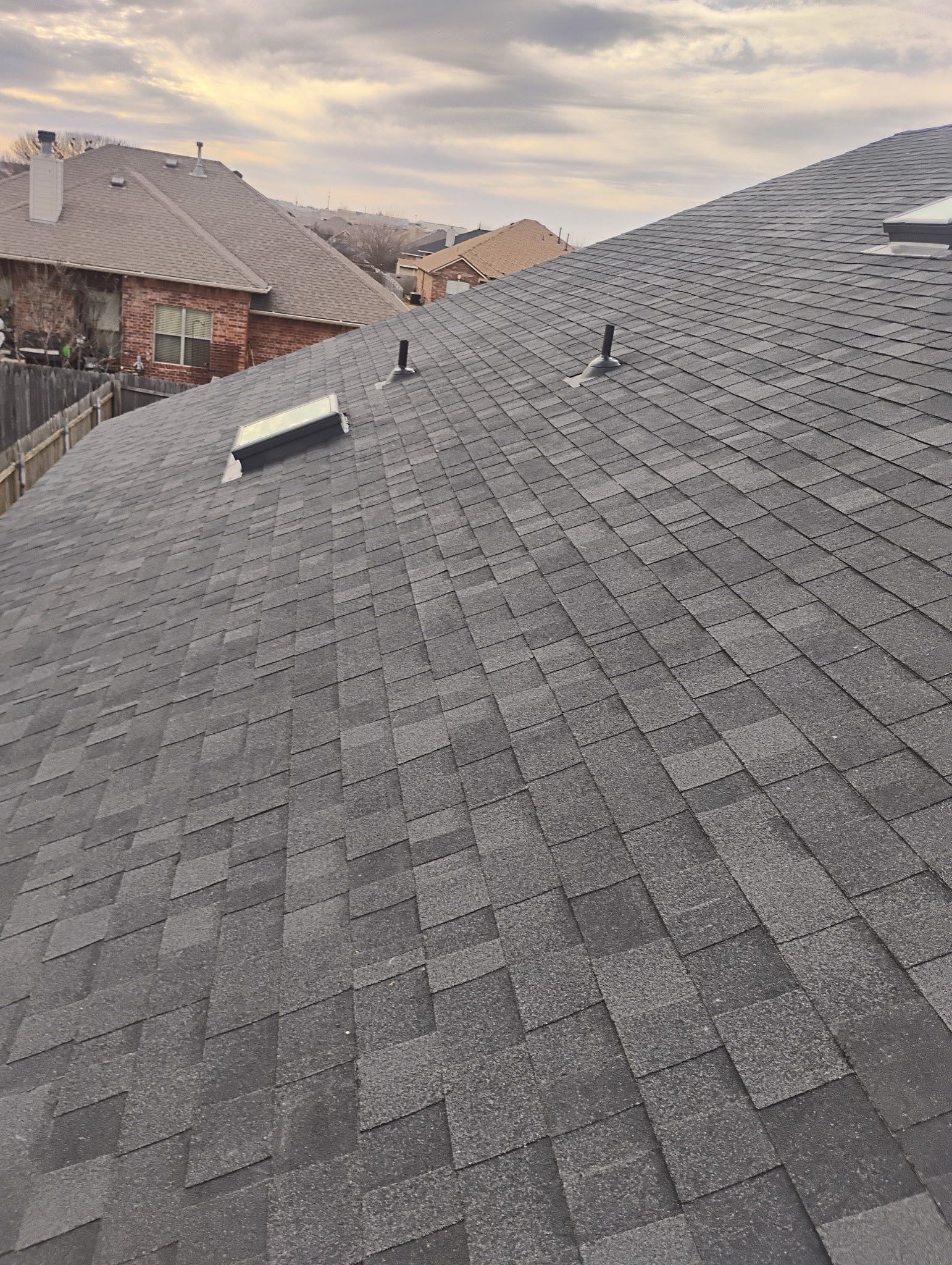 roof replacement & skylight installation & gutter installation in Oklahoma City by McCann's Roofing and Construction