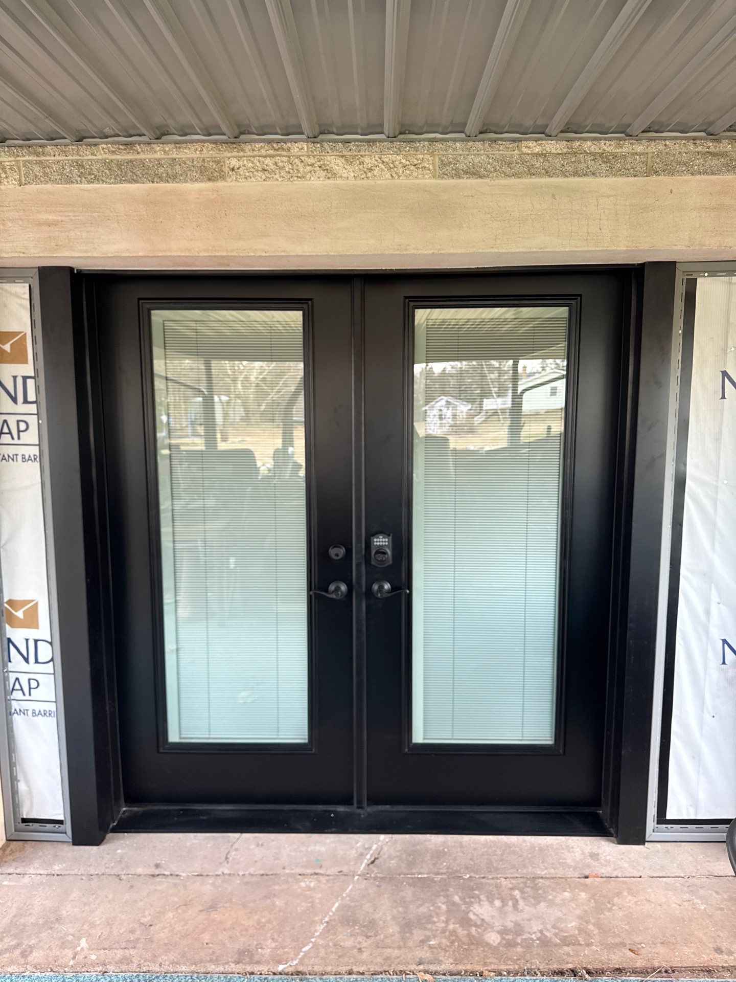 Metal Roofing, Board & Batten Siding, and Entry Door Transformation by Esh Builders