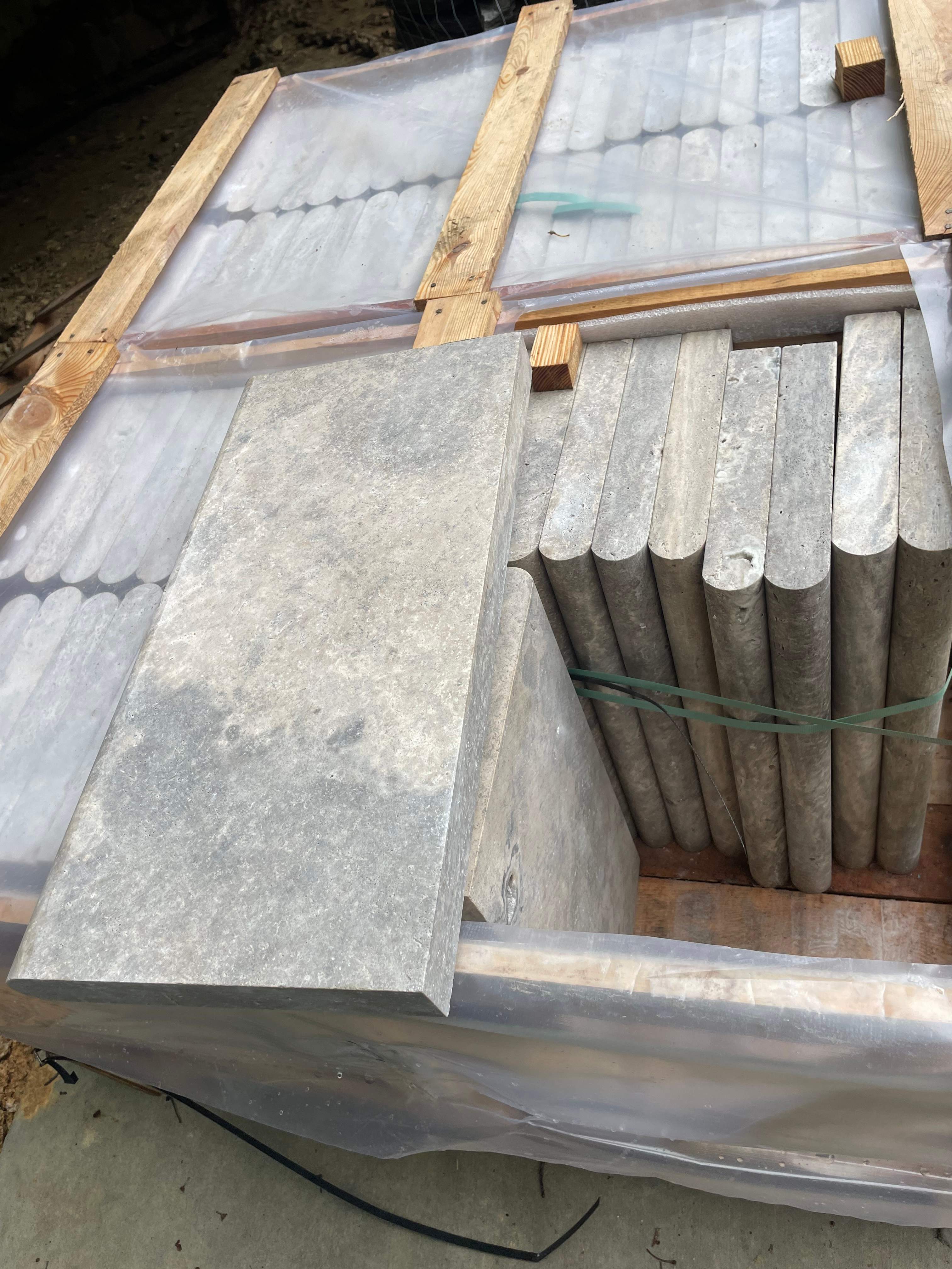 Pool Surround remodel with retaining walls, new waterfall and water slide by Fairfax Contractors, LLC