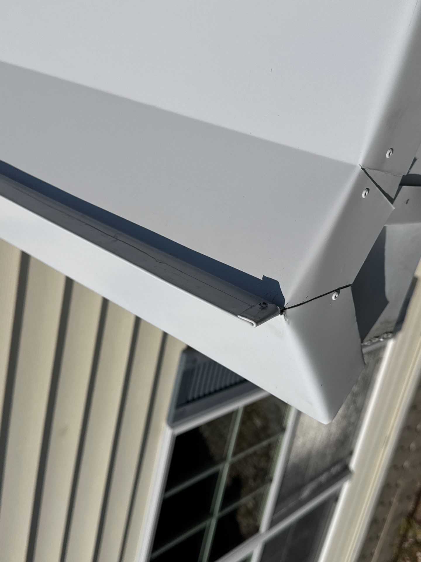 White Standing Seam Metal Roof Installation in Wake, VA by Cade Construction