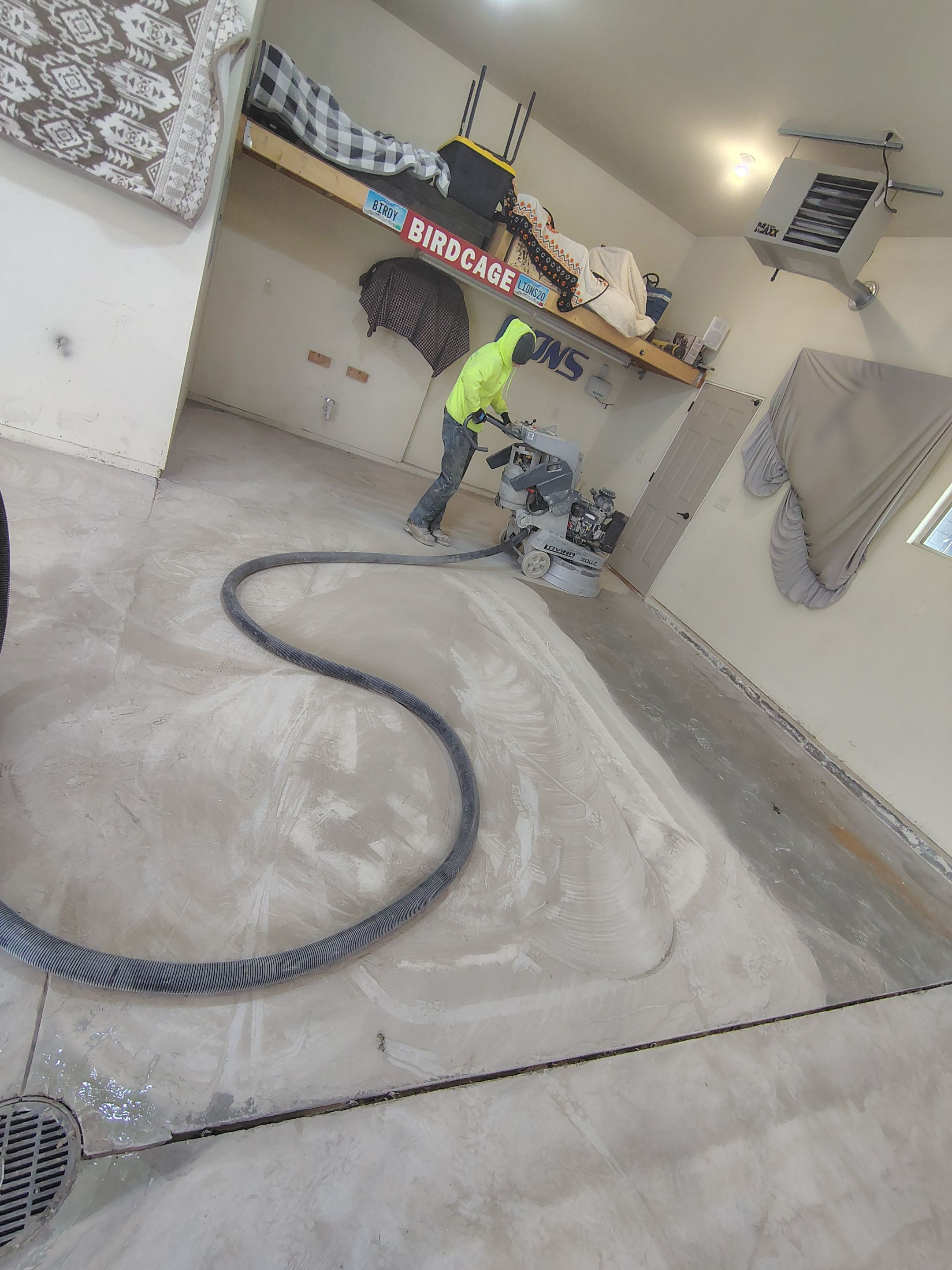 Sioux Falls Garage Floor Repair and Speckled Epoxy Coating Installation by Select Painting, Coatings & Garage Cabinets