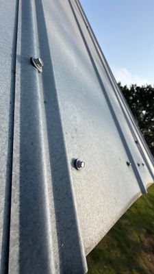 Vertical angle of metal roof panels and fasteners