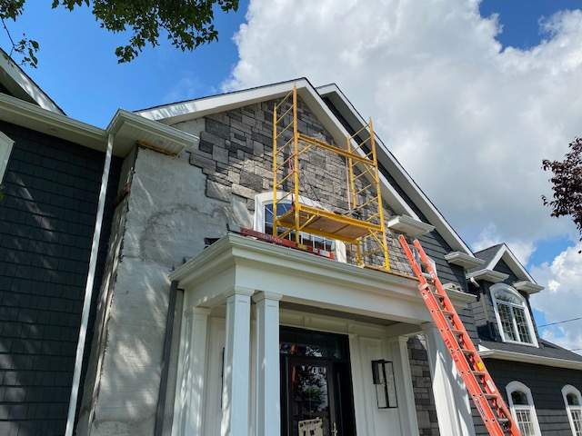 Exterior Renovations- Siding, Concrete, Railings, and Entry Door  by Ivy Lea Construction