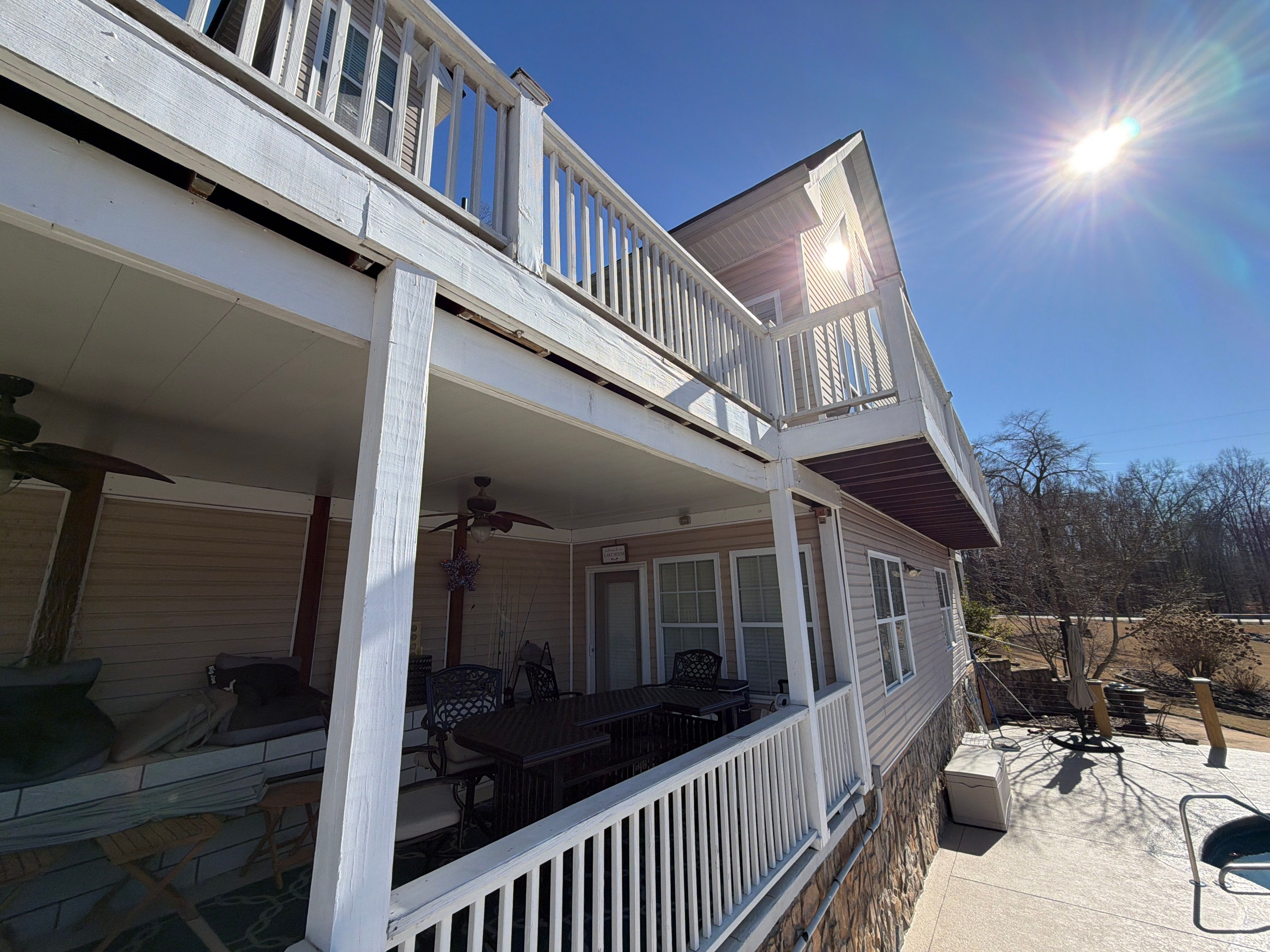 Cumming, GA Lake House Deck Resurface and Extension using Pressure Treated Pine and Skyline Cable Railing by Nelson Exteriors 