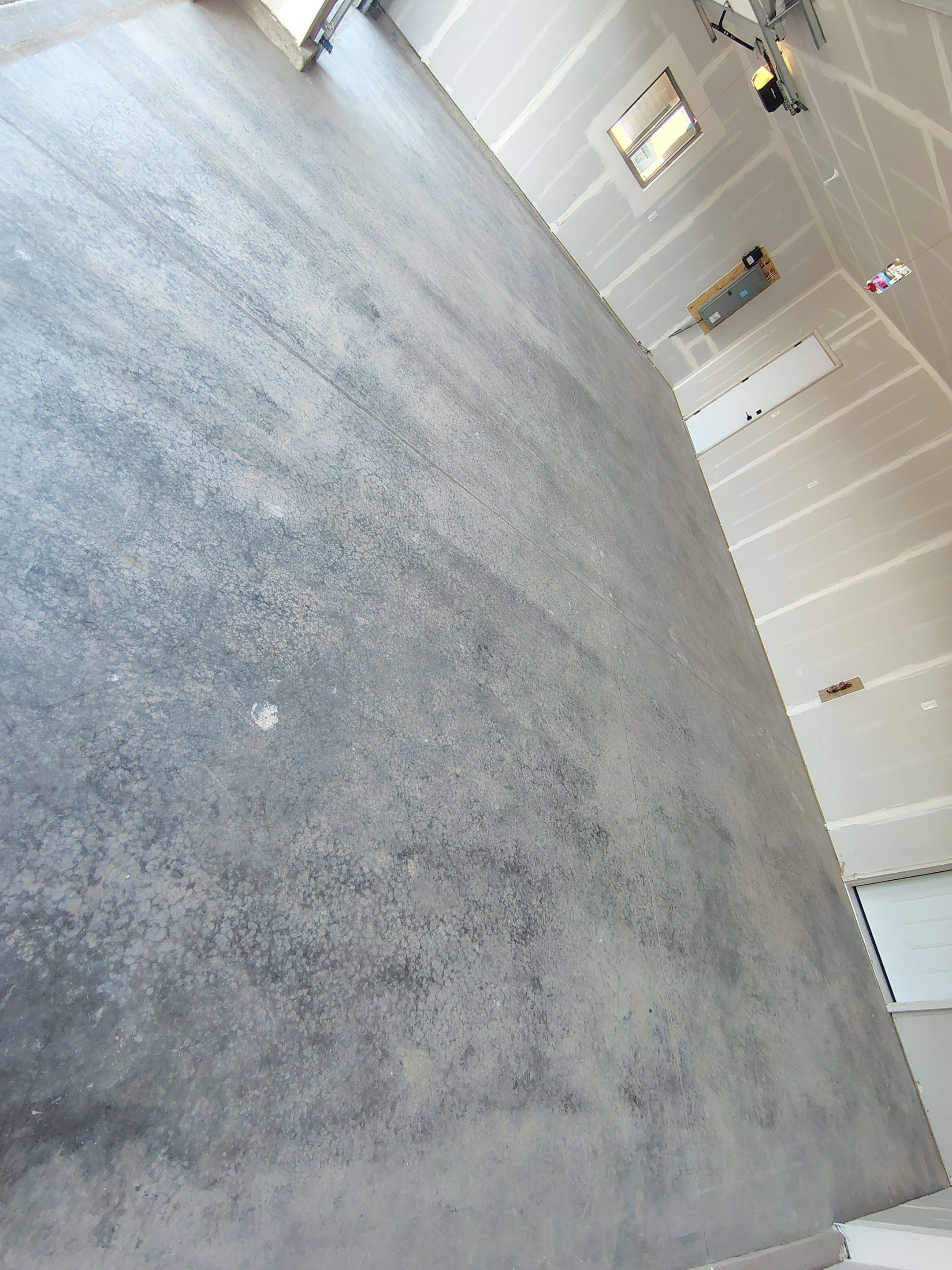 Speckled Epoxy Garage Floor Coating Installation in Sioux Falls by Select Painting, Coatings & Garage Cabinets