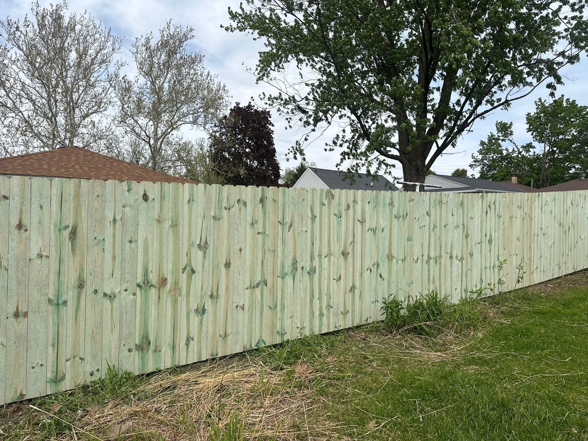 Pressure-Treated Wood Privacy Fence Installation in Waterloo by Perfect Picket Fence and Stain