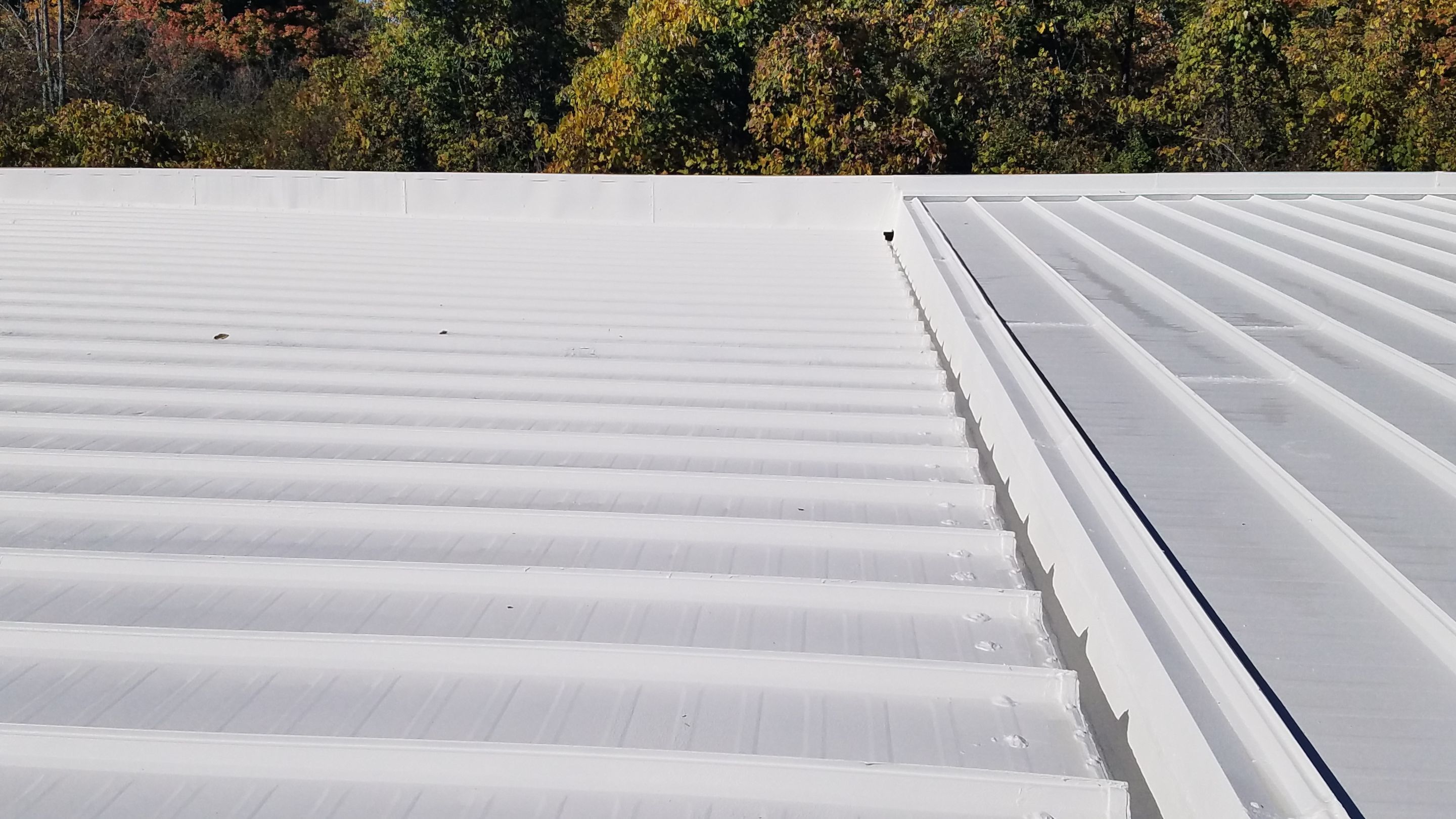 Commercial Metal Roof Coating by Gold Star Roofing LLC