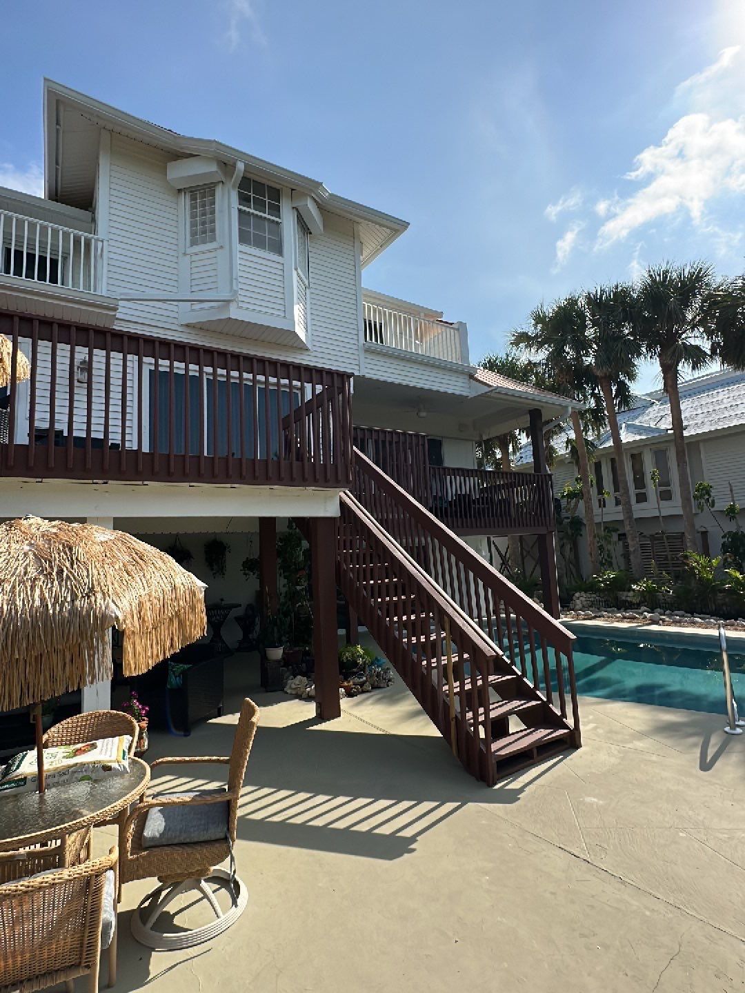 White K-Style Gutters Installed with White Downspouts in Sanibel FL by Gutter Professors