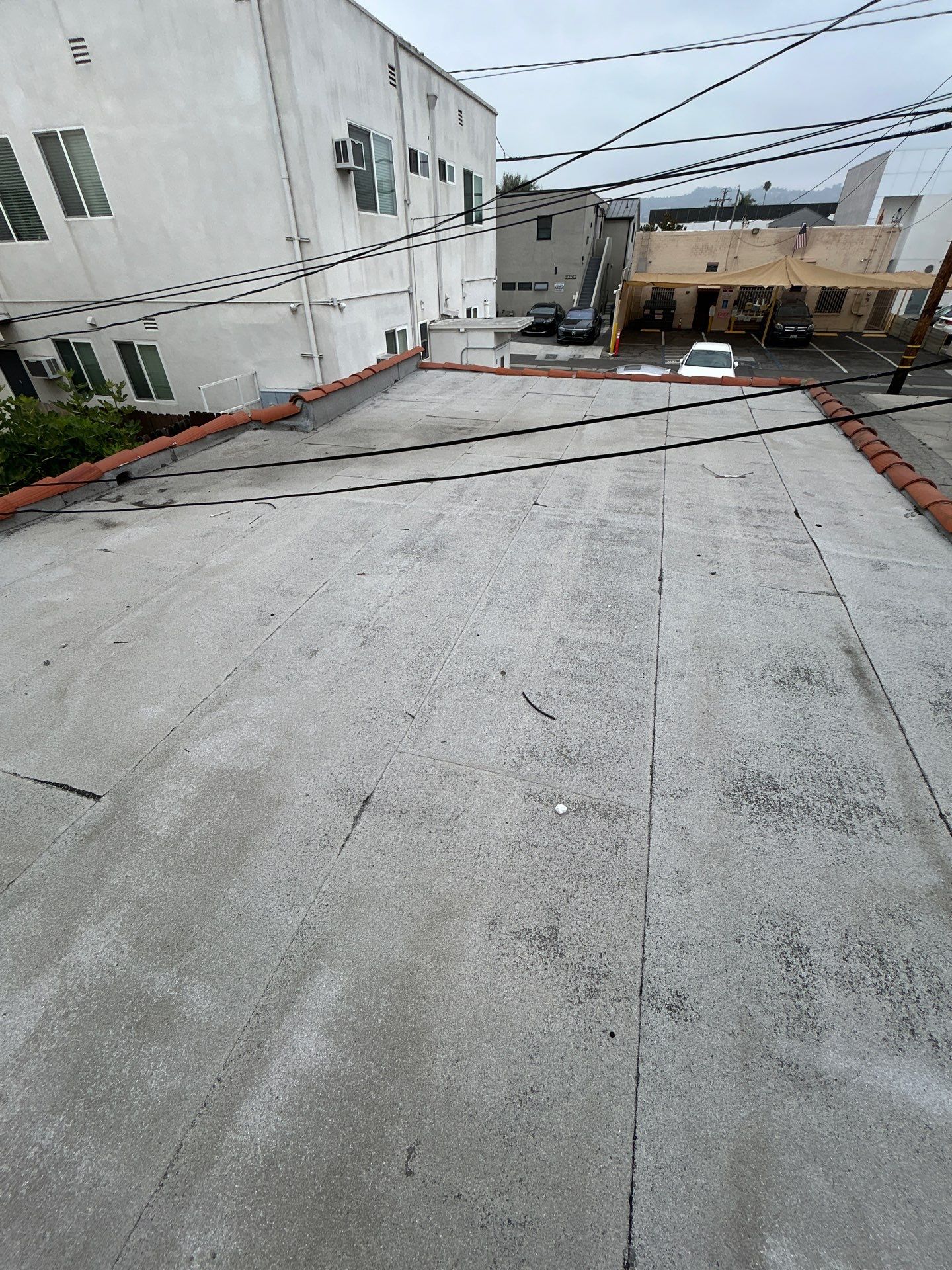 Beverly Hills Flat Roof Coating and Terracotta Tile Reset by Hull Brothers Roofing