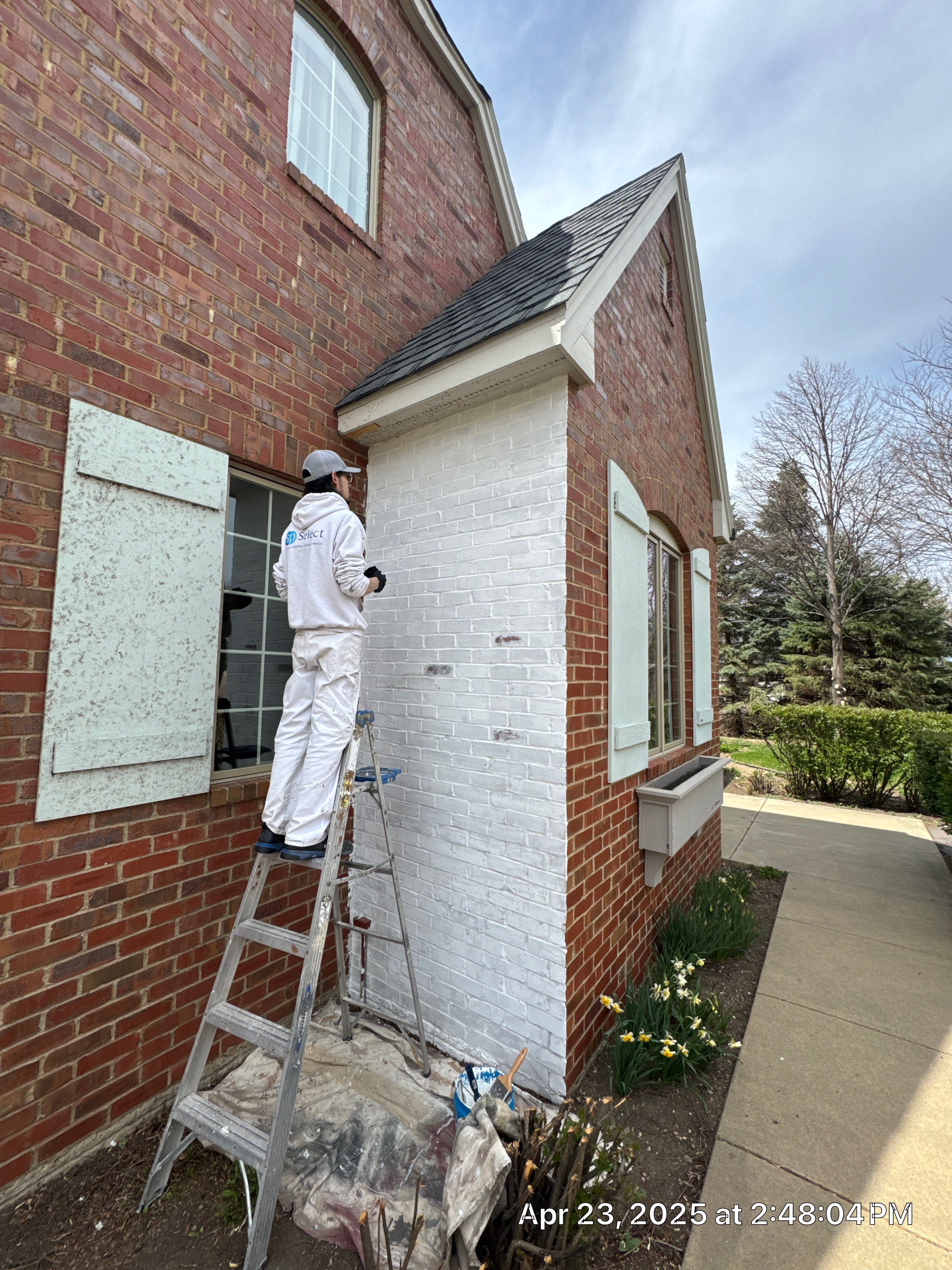 Residential Exterior Brick Painting and Limewash Refresh in Sioux Falls by Select Painting, Coatings & Garage Cabinets