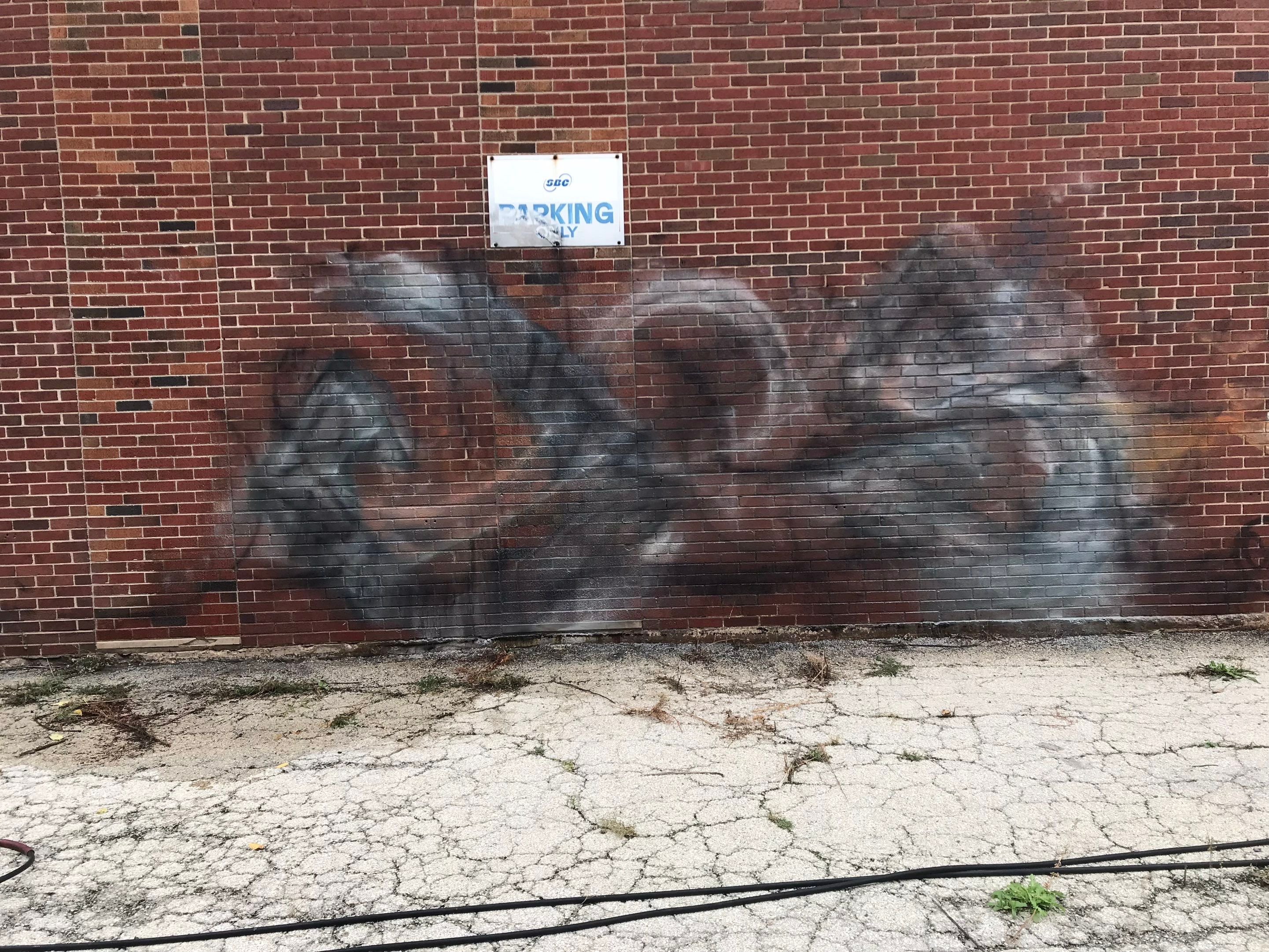 Graffiti removal  using Graffiti remover by Northern Power Washing LLC.