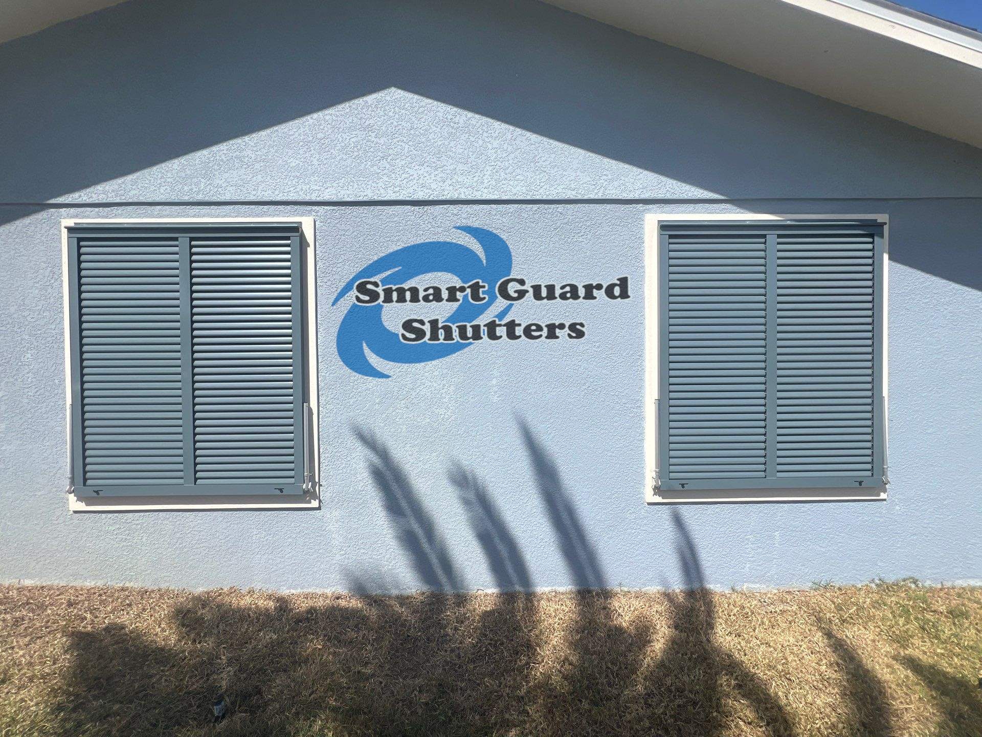 Impact Bahama Shutters in Grey Blue by Smart Guard Shutters