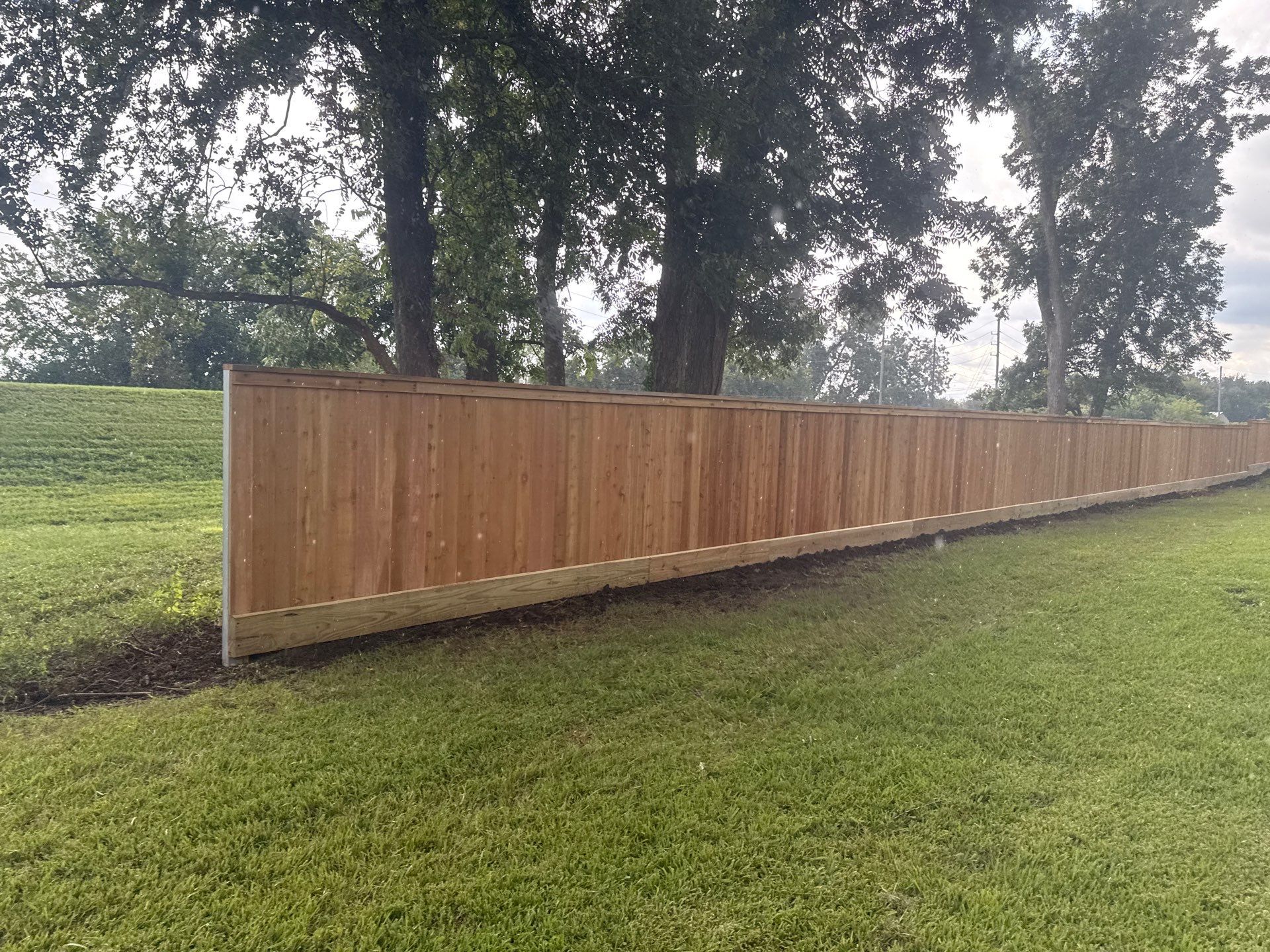 Wood Fence Installation for HOA by Tim's Fences