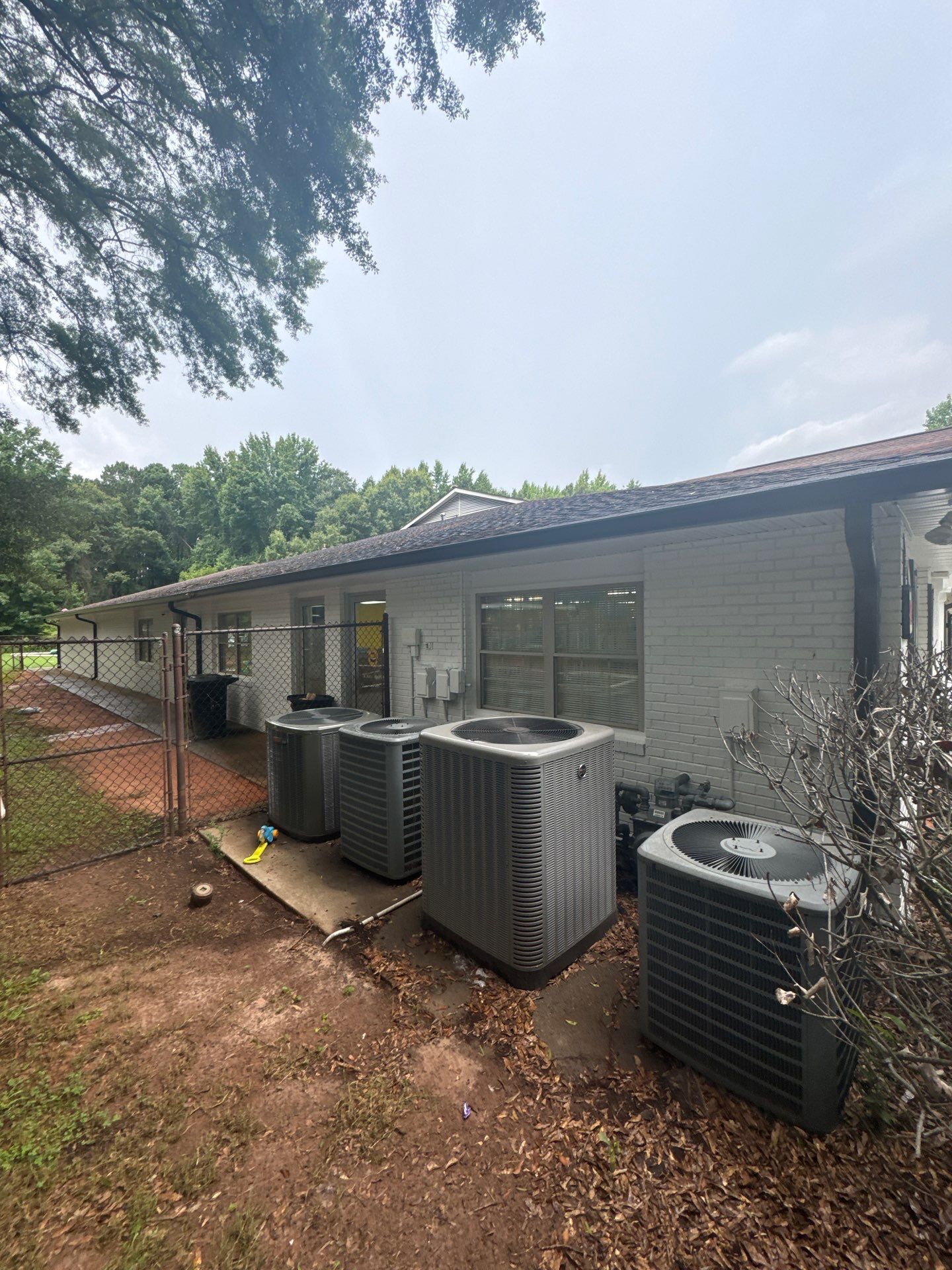 Commercial Exterior Brick and Stucco Painting in Fayetteville by Swift Home Renovations