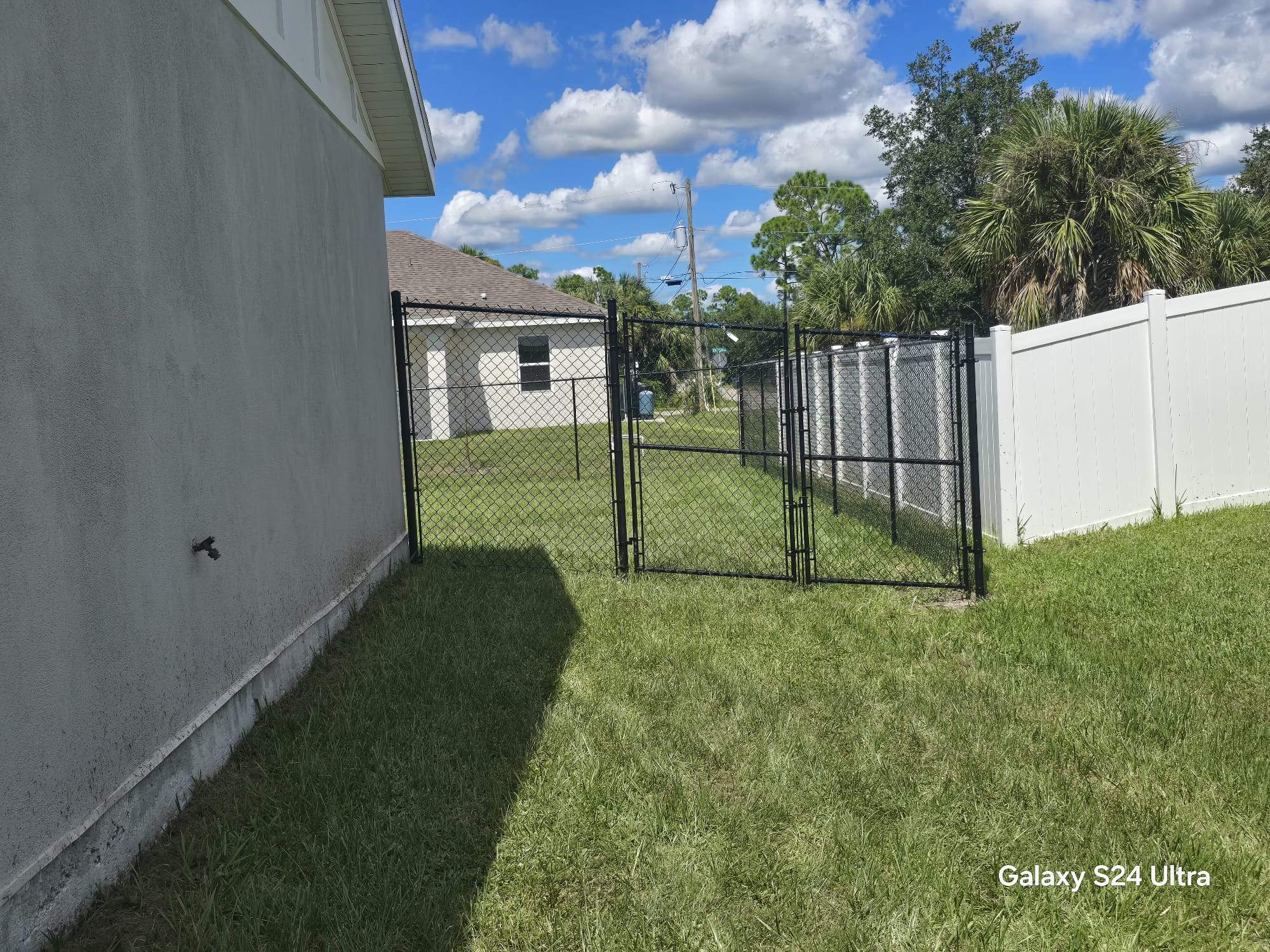 Residential Black Chain Link Fence Installation in North Port by True Fence LLC