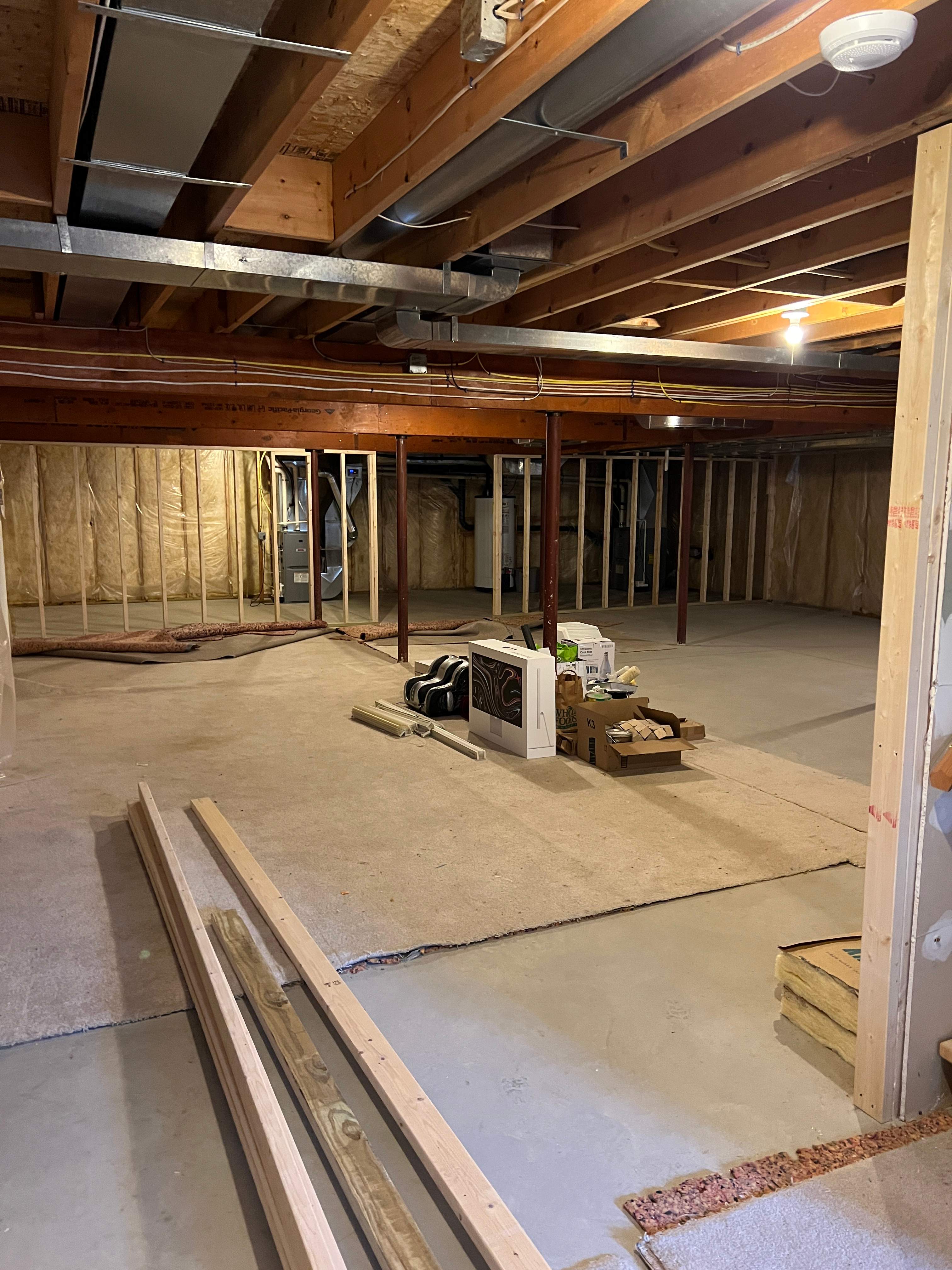 Basement Remodel w/ LVP Flooring & Exposed Ceiling by Chagnon Building & Remodeling LLC
