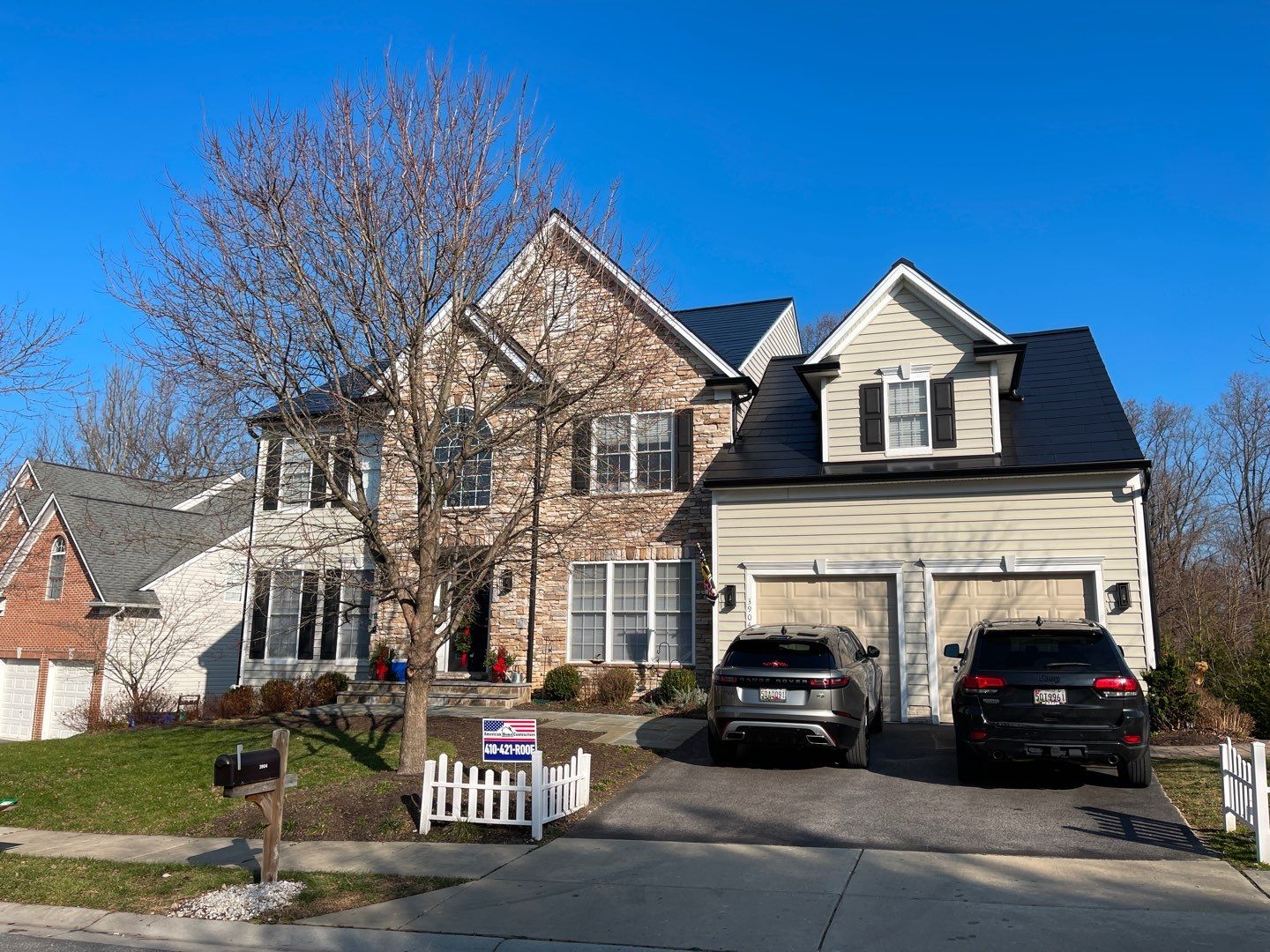 Tesla Solar Roof and Gutter Installation by American Home Contractors