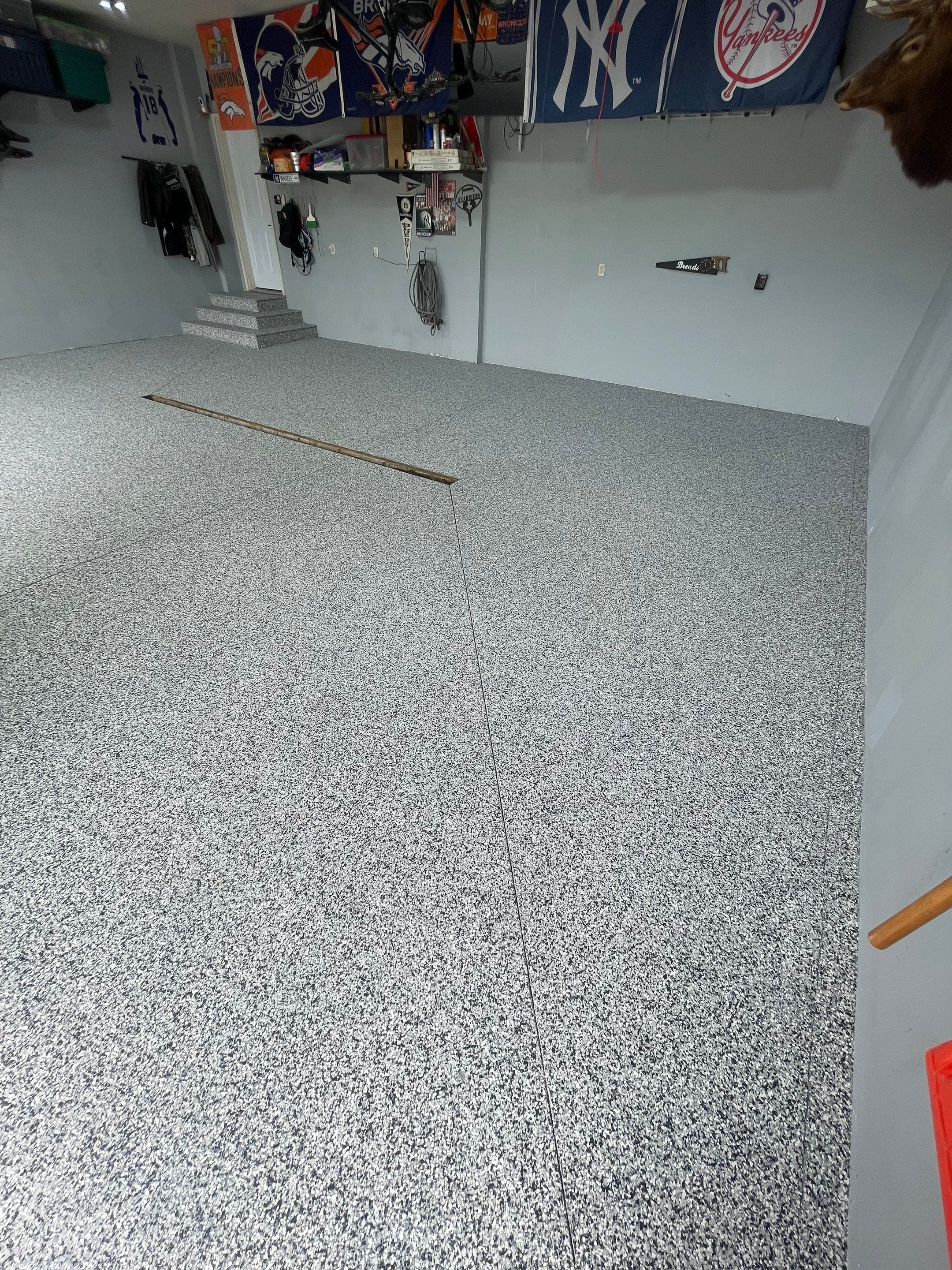 Full Garage Floor Epoxy Coating Installation in Dell Rapids by Select Painting, Coatings & Garage Cabinets