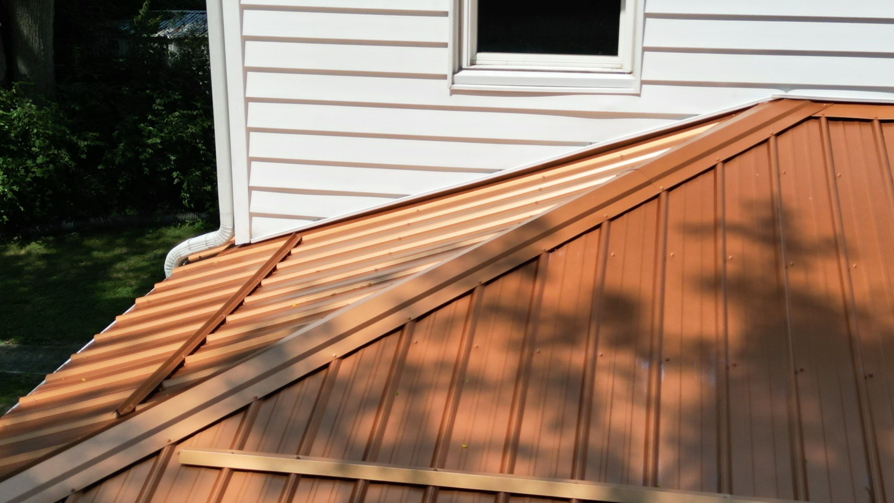 Residential Roofing Installation using Performance Panel Metal - Copper Metallic by RoofX 