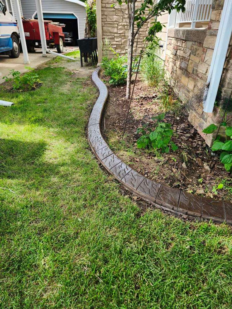 Decorative Stamped Concrete Landscape Edging Installation in Medicine Hat by Pump it Up Concrete Jacking