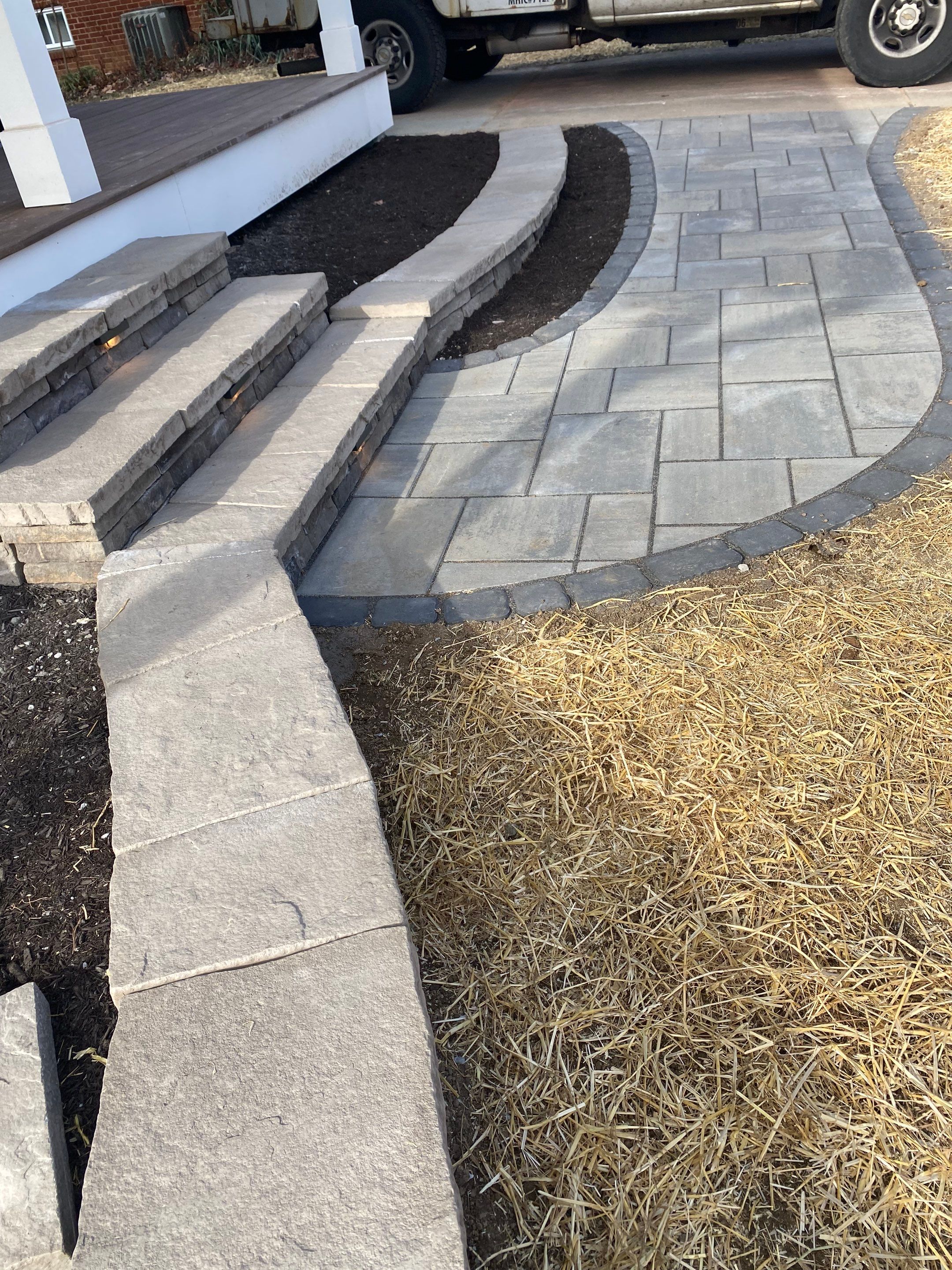 Retaining wall, walkway, small patio and landscape install by The Smet Companies, LLC