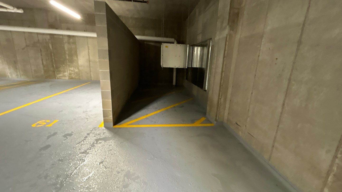 Parking garage using Hot water by Northern Power Washing LLC.