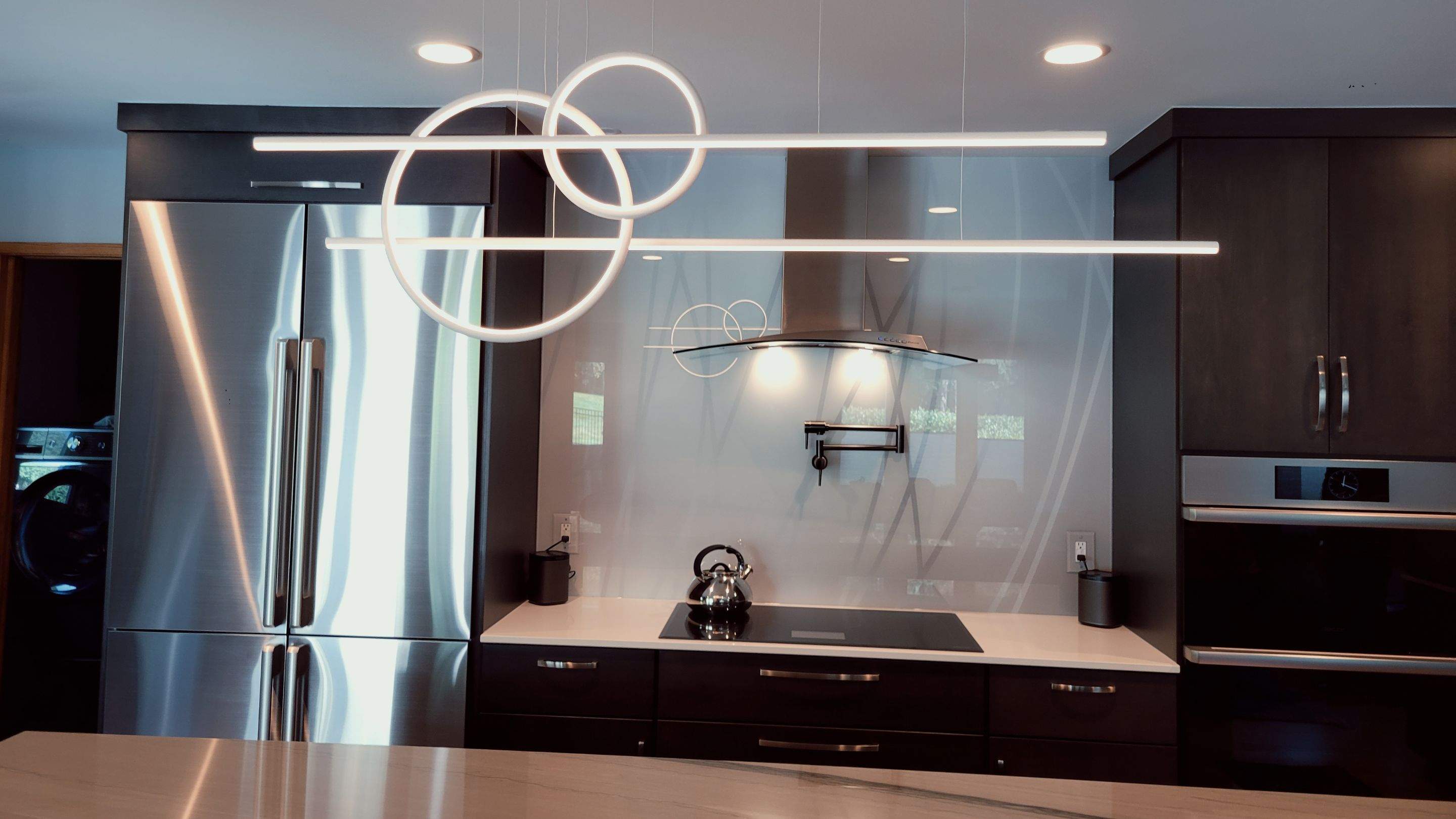 Kitchen Remodel using IMAGIO Misty Curves Solid Glass Backsplash by IMAGIO
