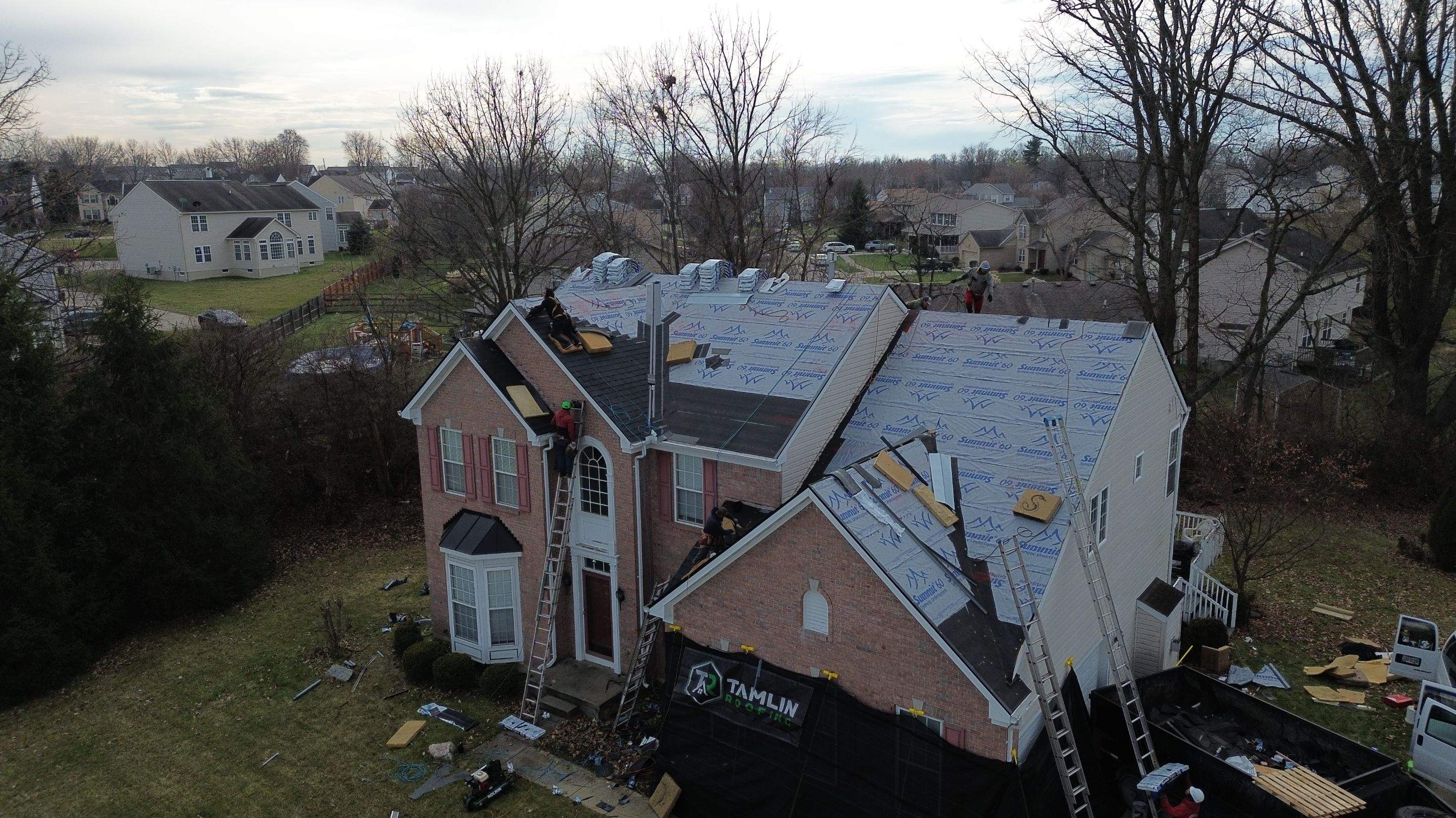 Walden Ponds - Pristine Black and Hydro Flo Gutter Guards by Tamlin Roofing