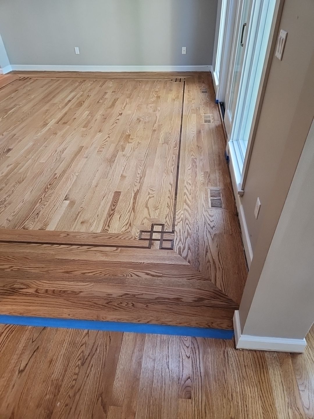 Ann Arbor Elegance: Red Oak and Walnut Living Room Masterpiece by Ann Arbor Hardwoods