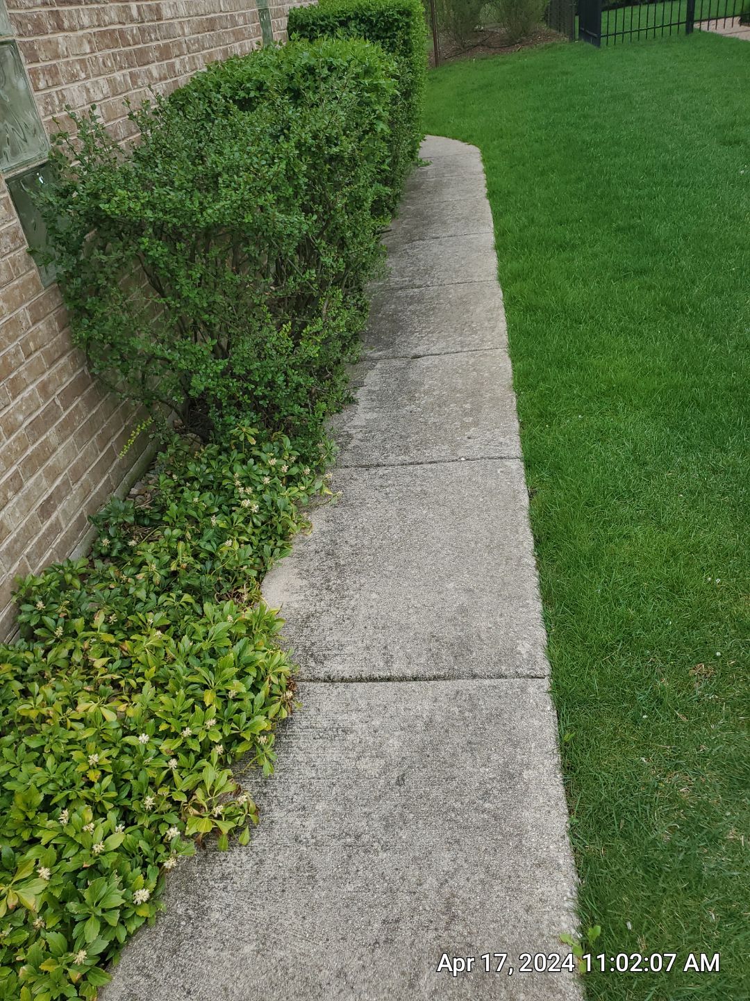 concrete patio and driveway cleaning by Northern Power Washing LLC.