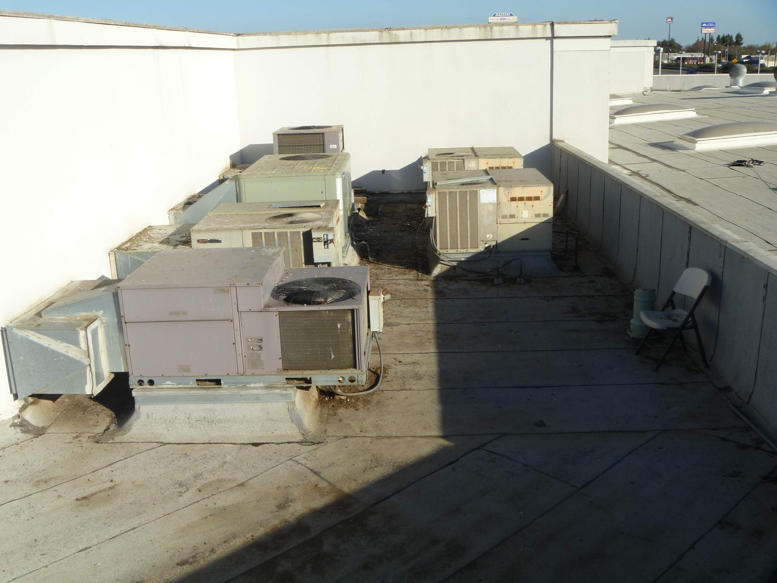 Commercial Roofing Installation using Spray foam and Conklin Benchmark/PUMA XL 18 yr warranty coatings by Straight Edge Roofing Inc