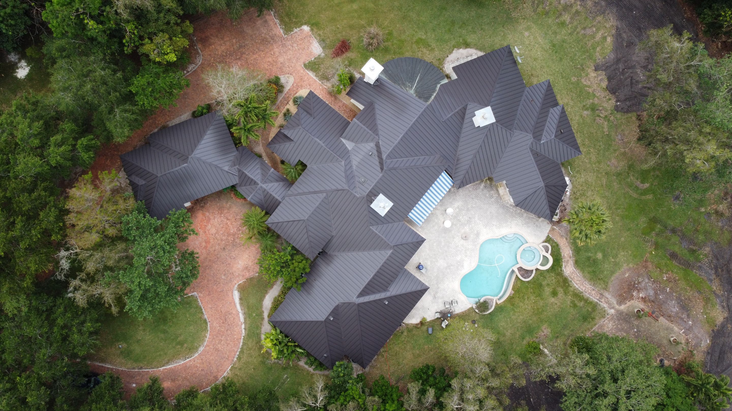 Residential Roofing Installation using 1" Nail strip metal roof by BLUES BROTHERS ROOFING