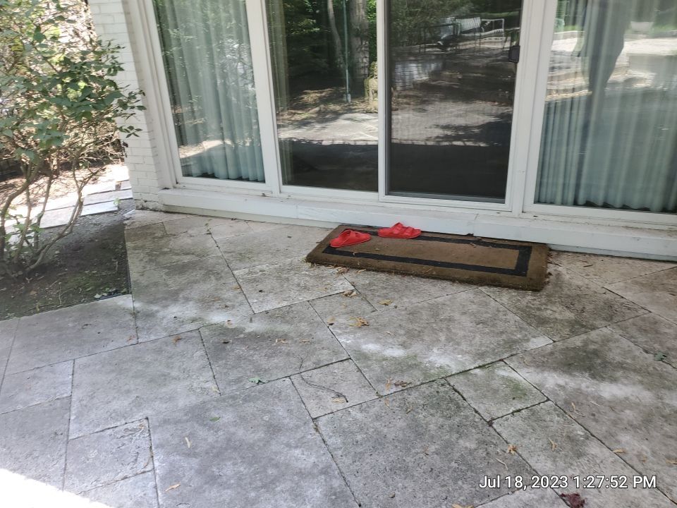 marble patio cleaning and sanding using Polysweep polymeric sand by Northern Power Washing LLC.