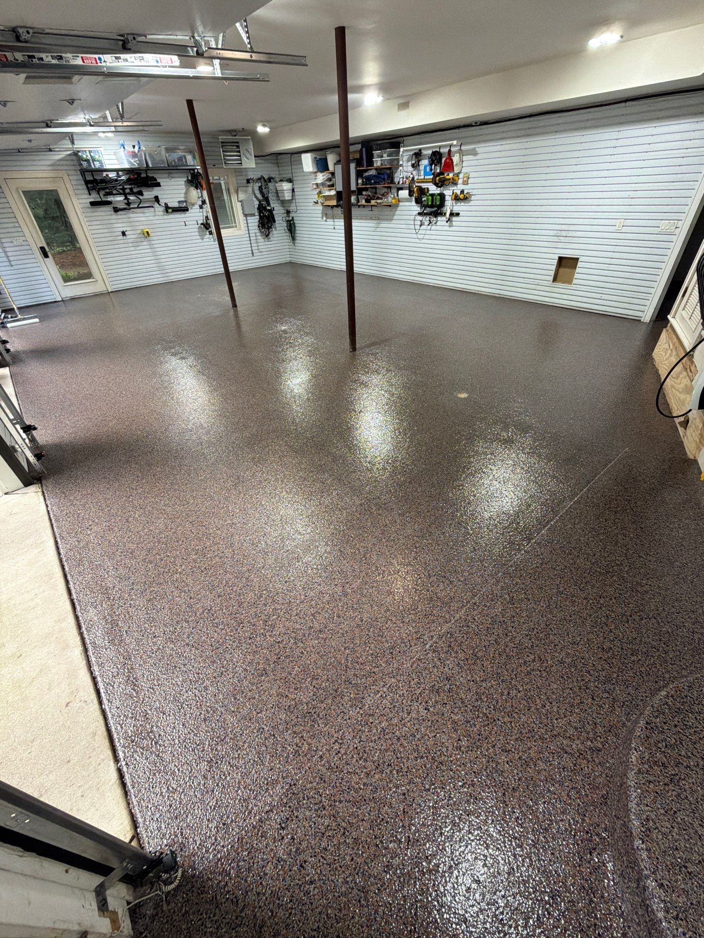 Residential Garage Epoxy Flake Floor Installation in Grand Haven by Gordon Painting